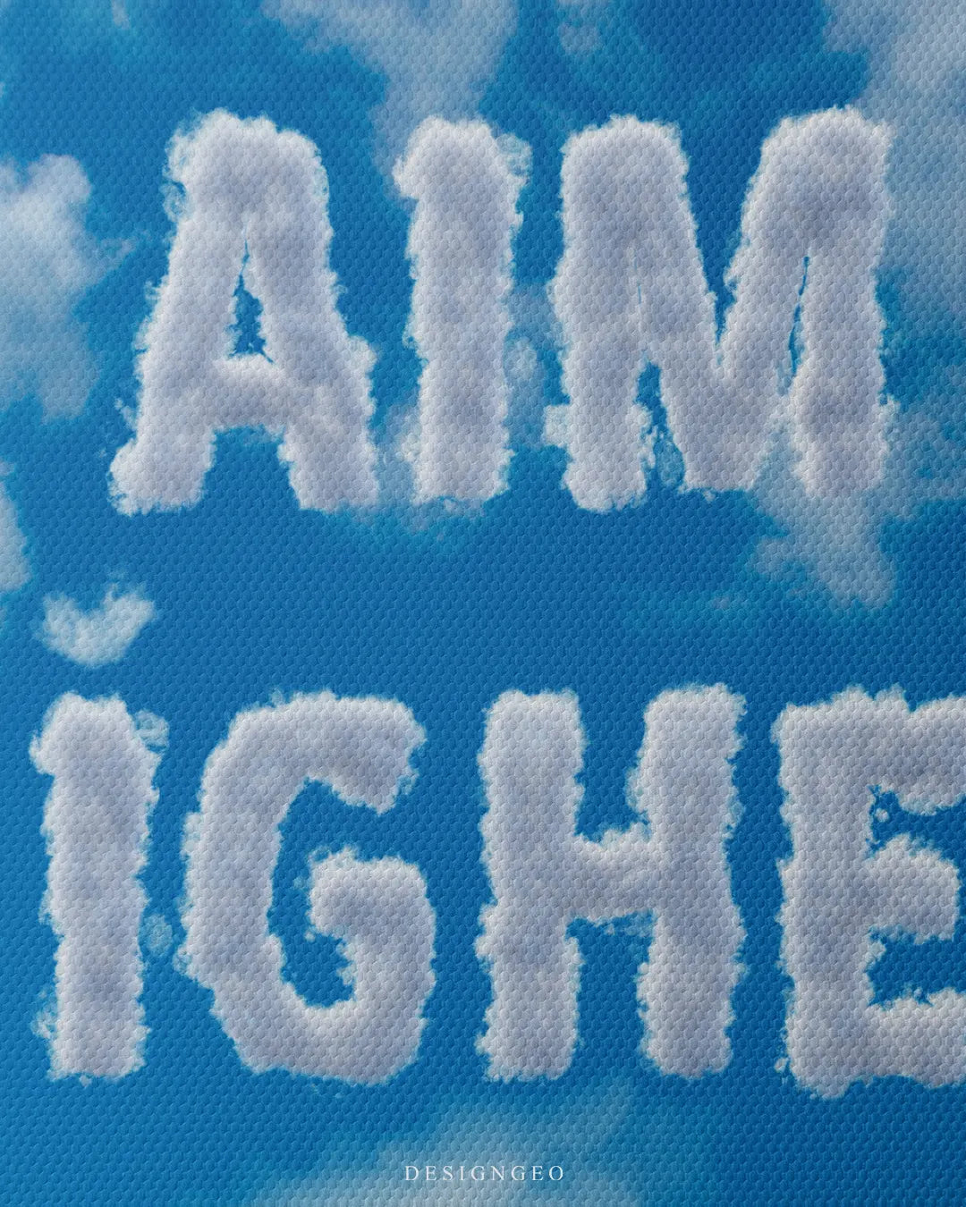 Medium shot showing fluffy white cloud text reading AIM HIGHER set against a clear blue sky background with subtle cumulus clouds
