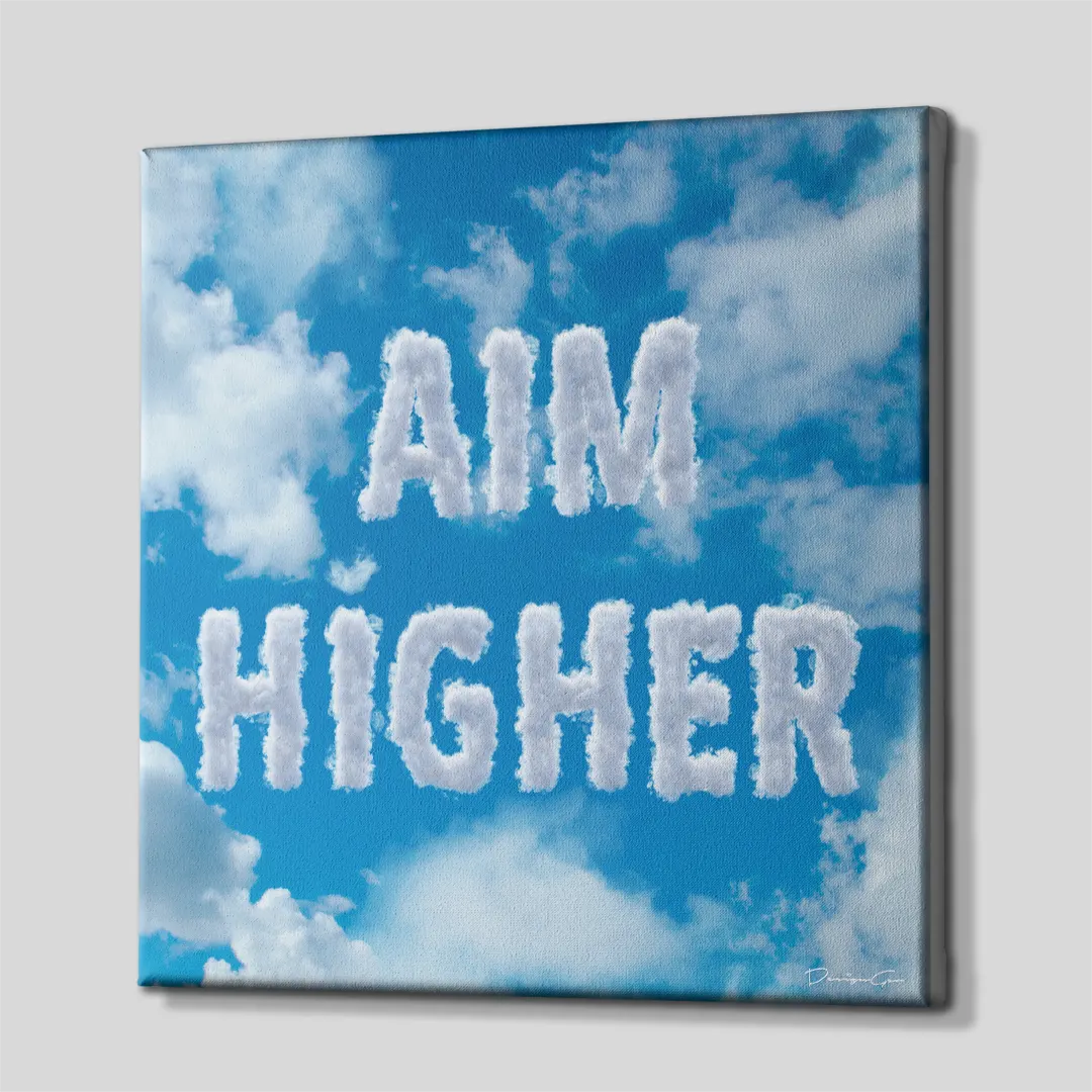 Three-quarter side angle of the Aim Higher cloud typography canvas wall art showing gallery-wrapped blue sky edges mounted on a wooden frame