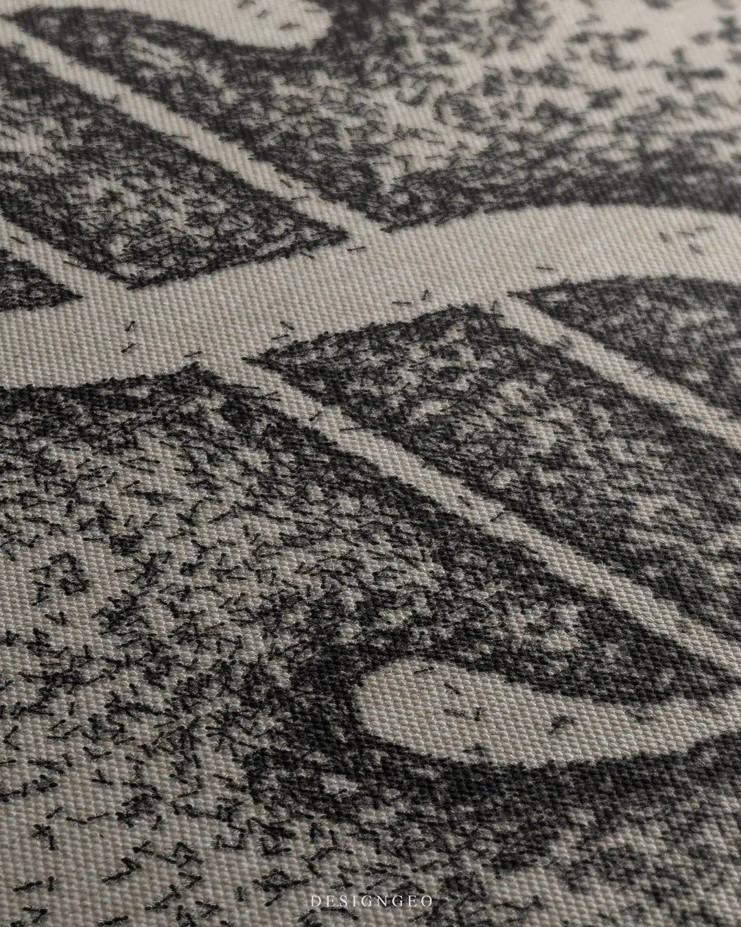 Close-up side view of a canvas wall art featuring small black ants forming a dollar sign, showing the high-quality print detail and woven fabric texture.