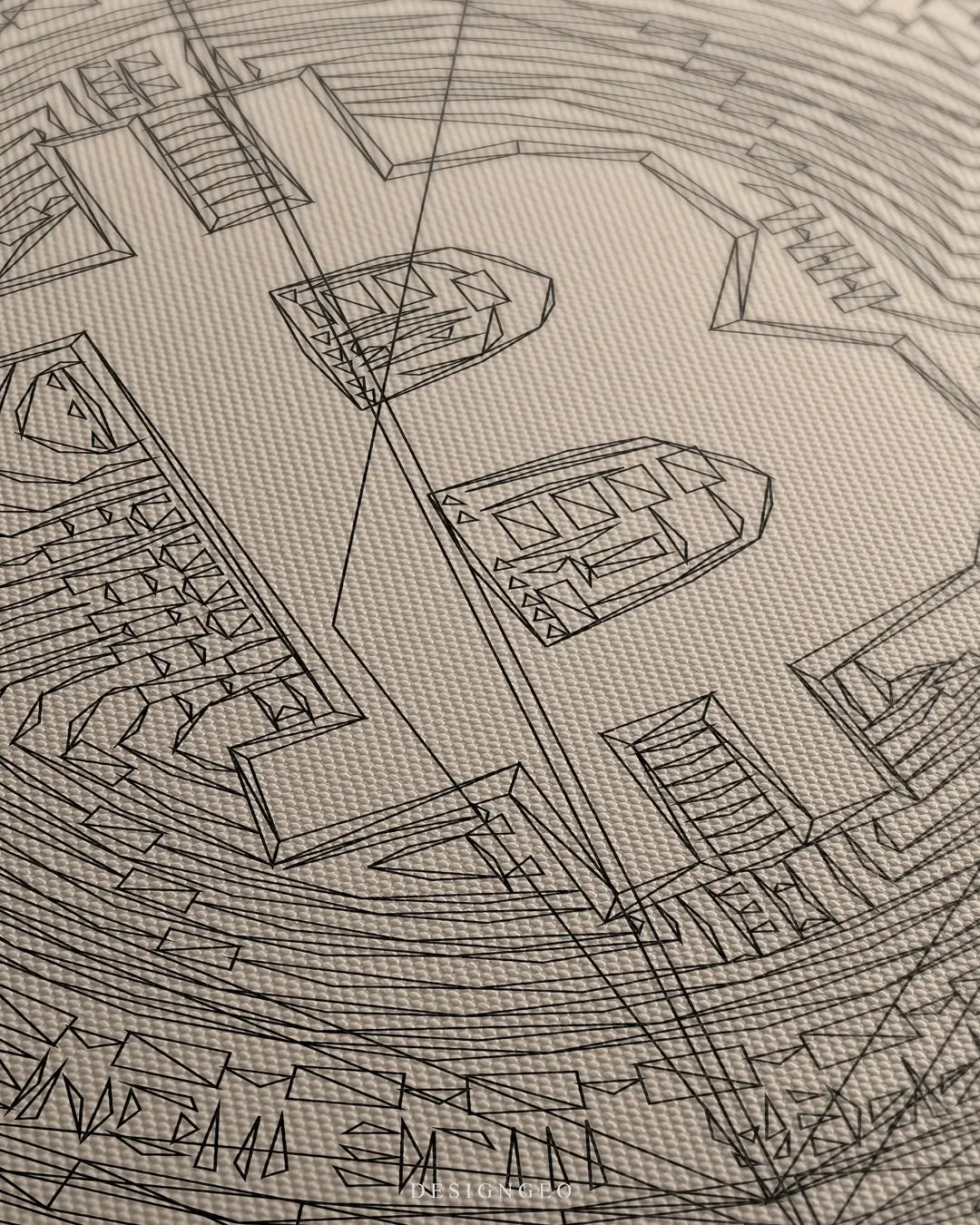 Close-up of minimalist Bitcoin wall art showing the BTC currency symbol and technical coin details in clean black lines on a neutral beige background