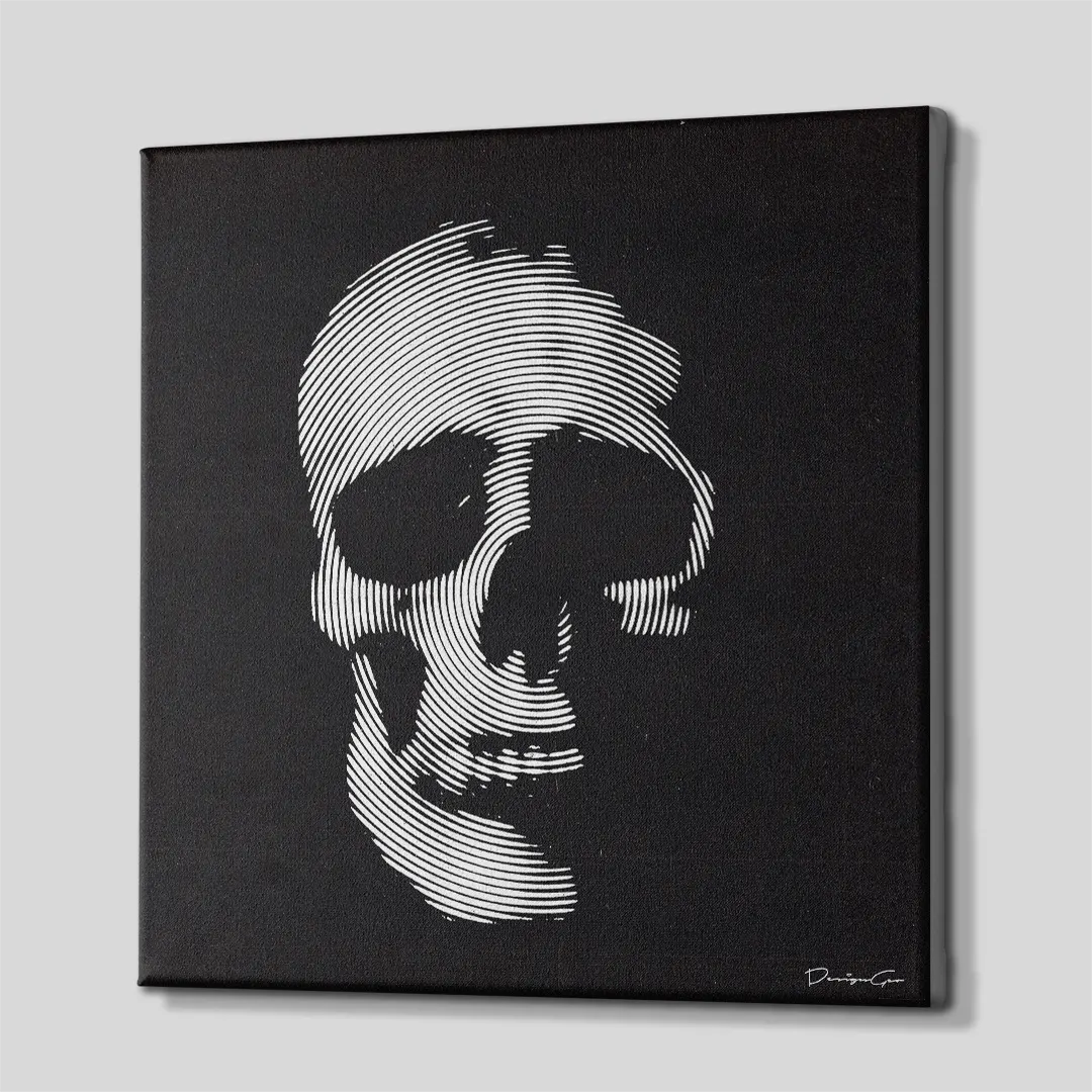 Three-quarter side angle of the monochrome skull canvas wall art showing gallery-wrapped black edges mounted on a solid wooden frame