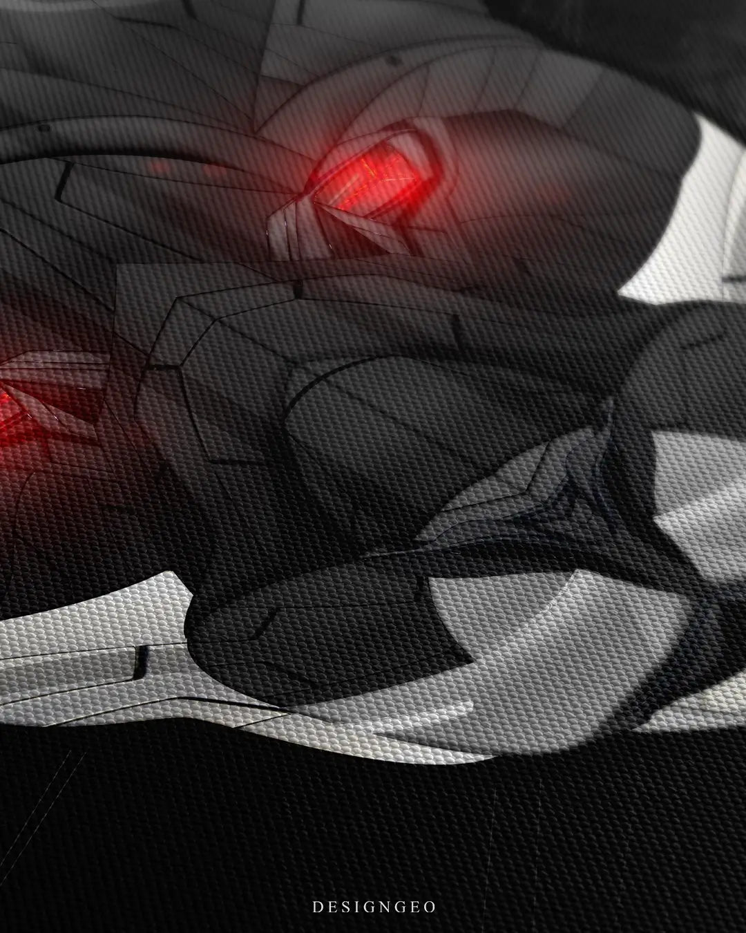 Close-up of futuristic wall art featuring a black panther portrait integrated with mechanical car parts and carbon fiber textures on a deep black background