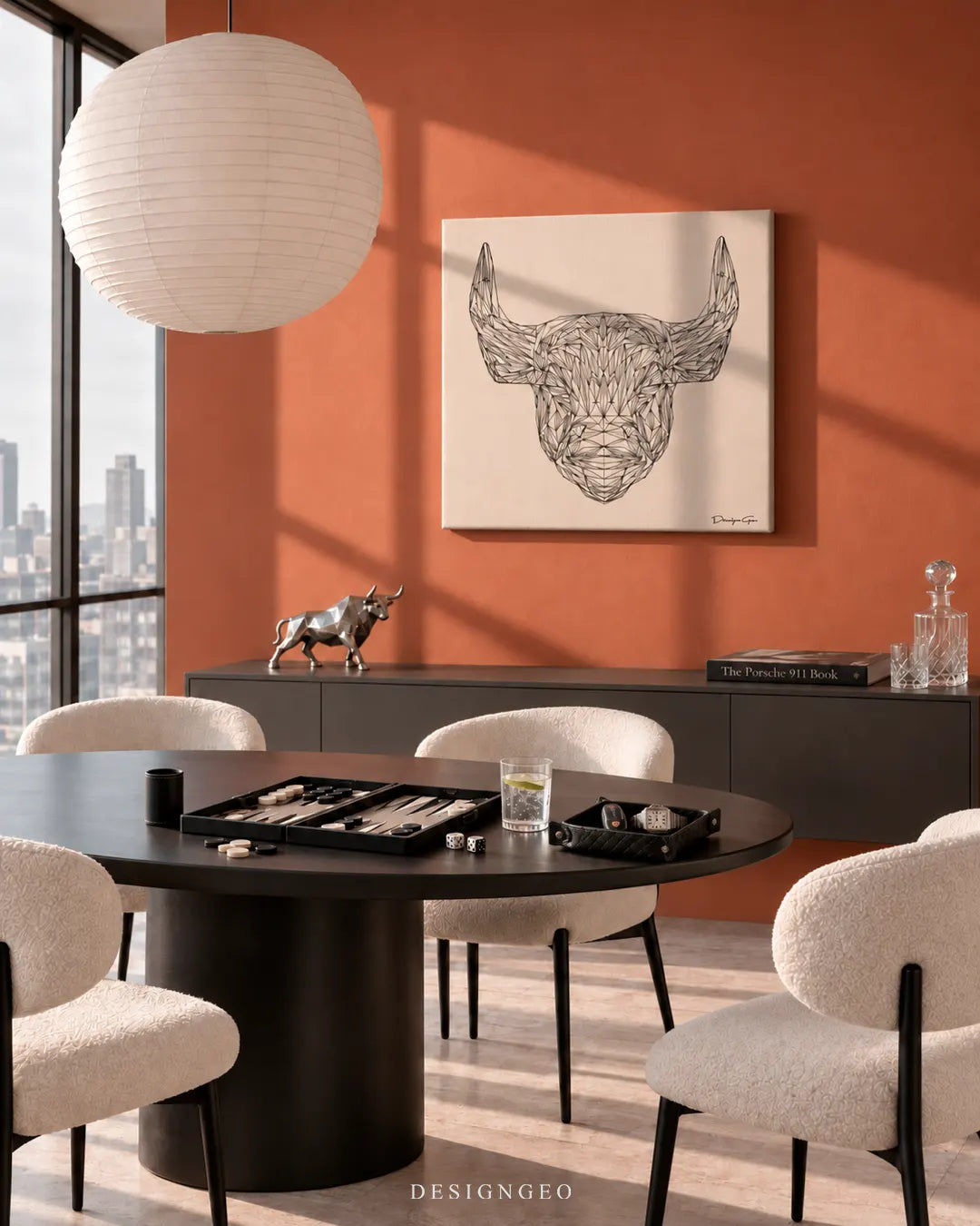 Modern dining room featuring a square canvas print of a black geometric bull head outline mounted on a warm terracotta wall above a dark sideboard