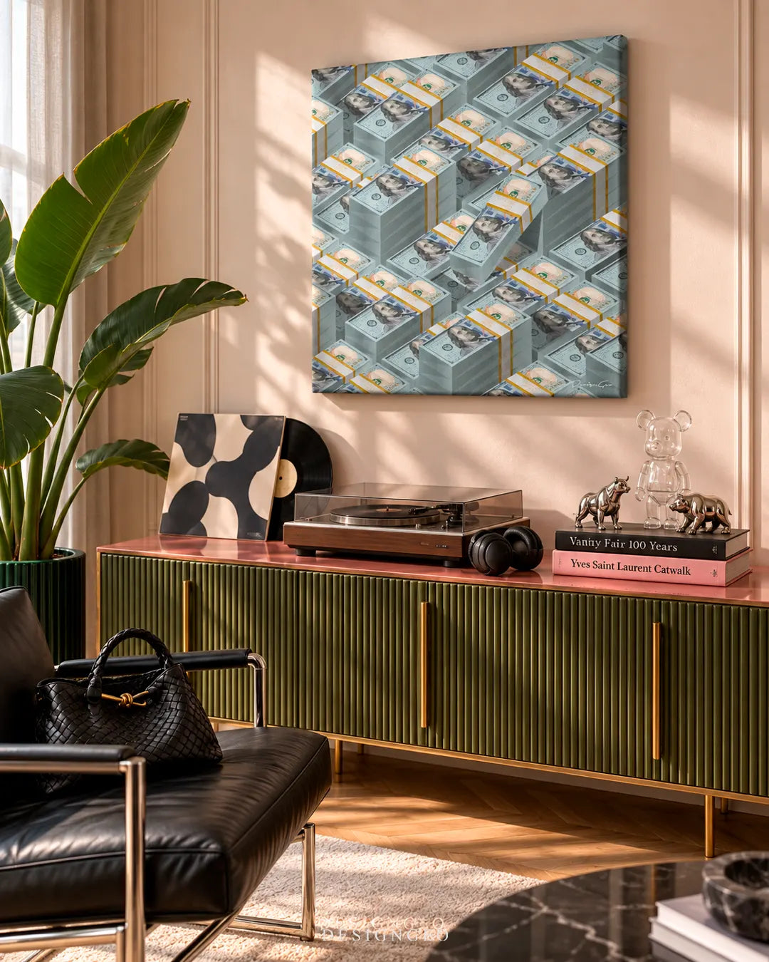 Modern luxury interior room featuring a square money canvas print of stacked 100 dollar bill cash bundles mounted on a beige wall above an olive green sideboard with gold accents