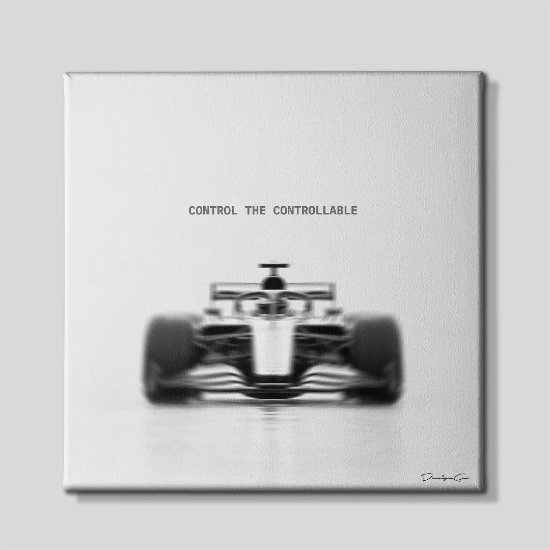 Black and white square canvas wall art featuring a blurred motion Formula 1 race car front view centered under quote Control The Controllable 0.75 inch thin wrap