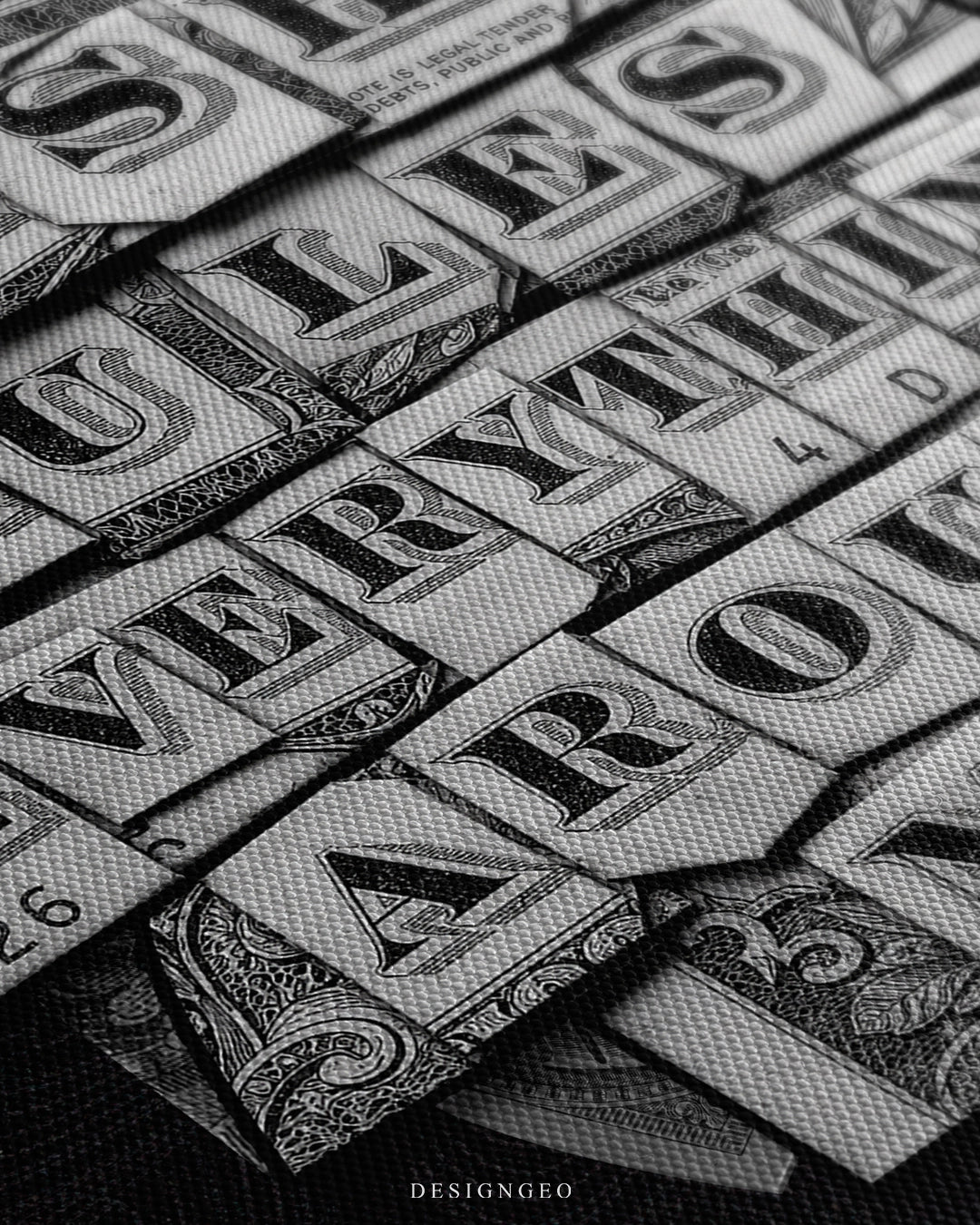 Angled macro view of the C.R.E.A.M. canvas print, showing textured US dollar bill fragments forming the typography for "Rules Everything Around" on a canvas surface