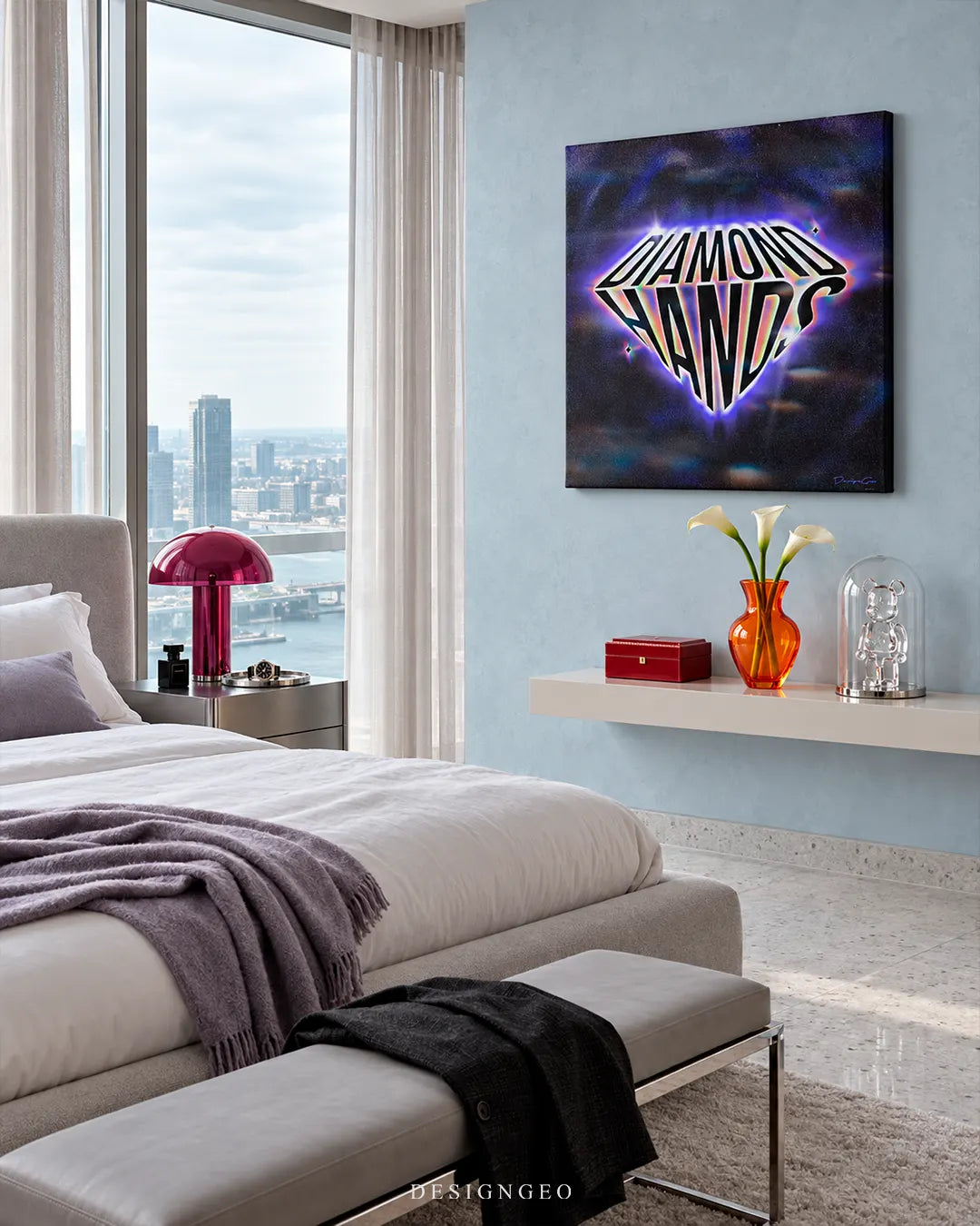 Square canvas print showing glowing DIAMOND HANDS crypto street art typography hanging on a light blue wall in a penthouse bedroom above a floating shelf