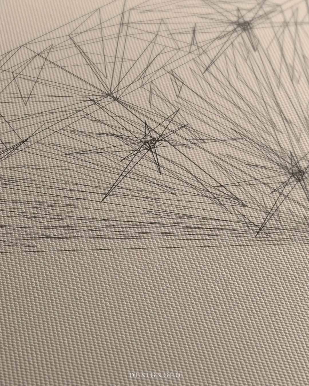 Close-up of minimalist diamond wall art featuring precise black lines representing the brilliant cut facets on a neutral beige canvas
