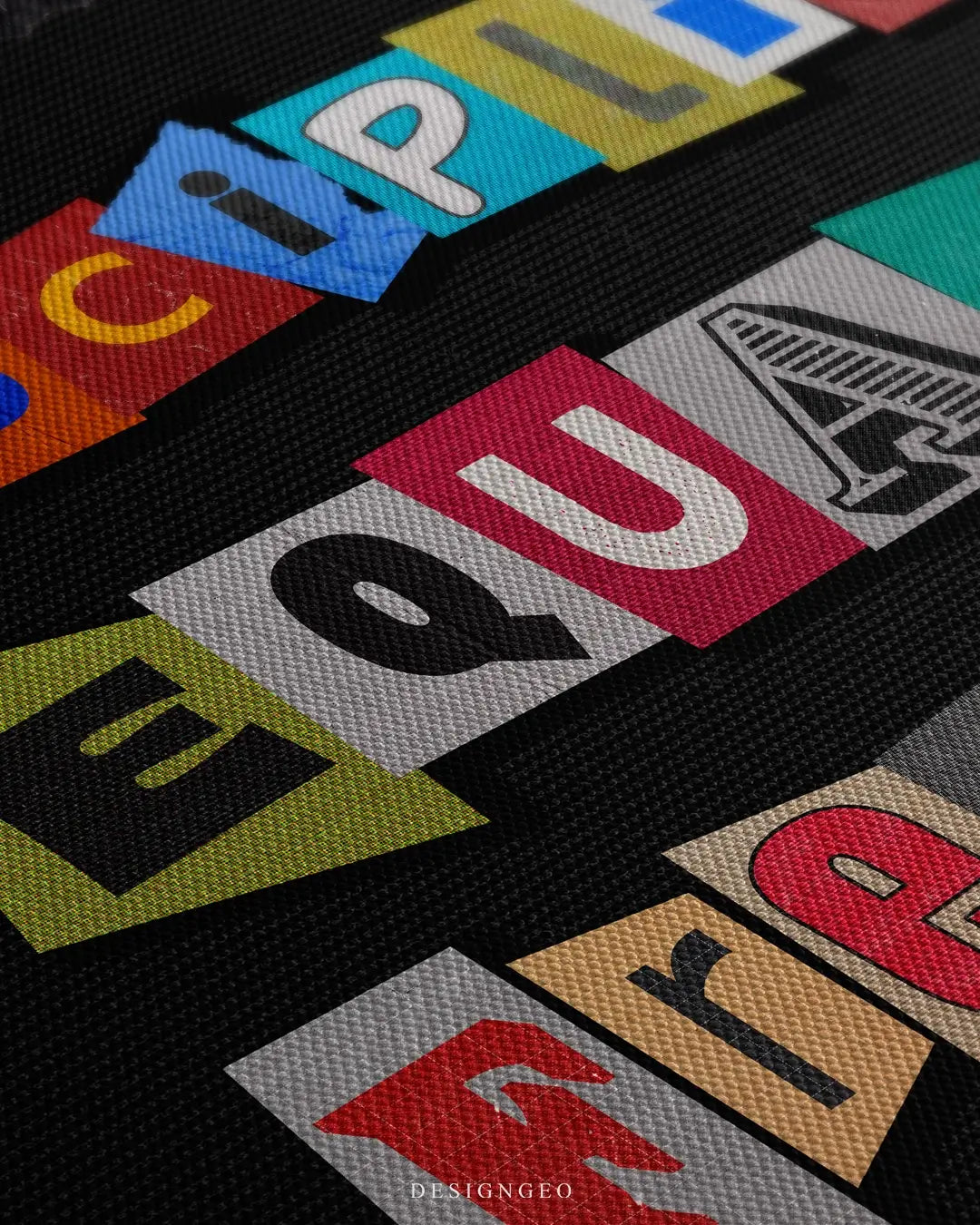 Close-up of motivational canvas art featuring the phrase "Discipline Equals Freedom" in vibrant colorful typography with realistic paint textures on a black background