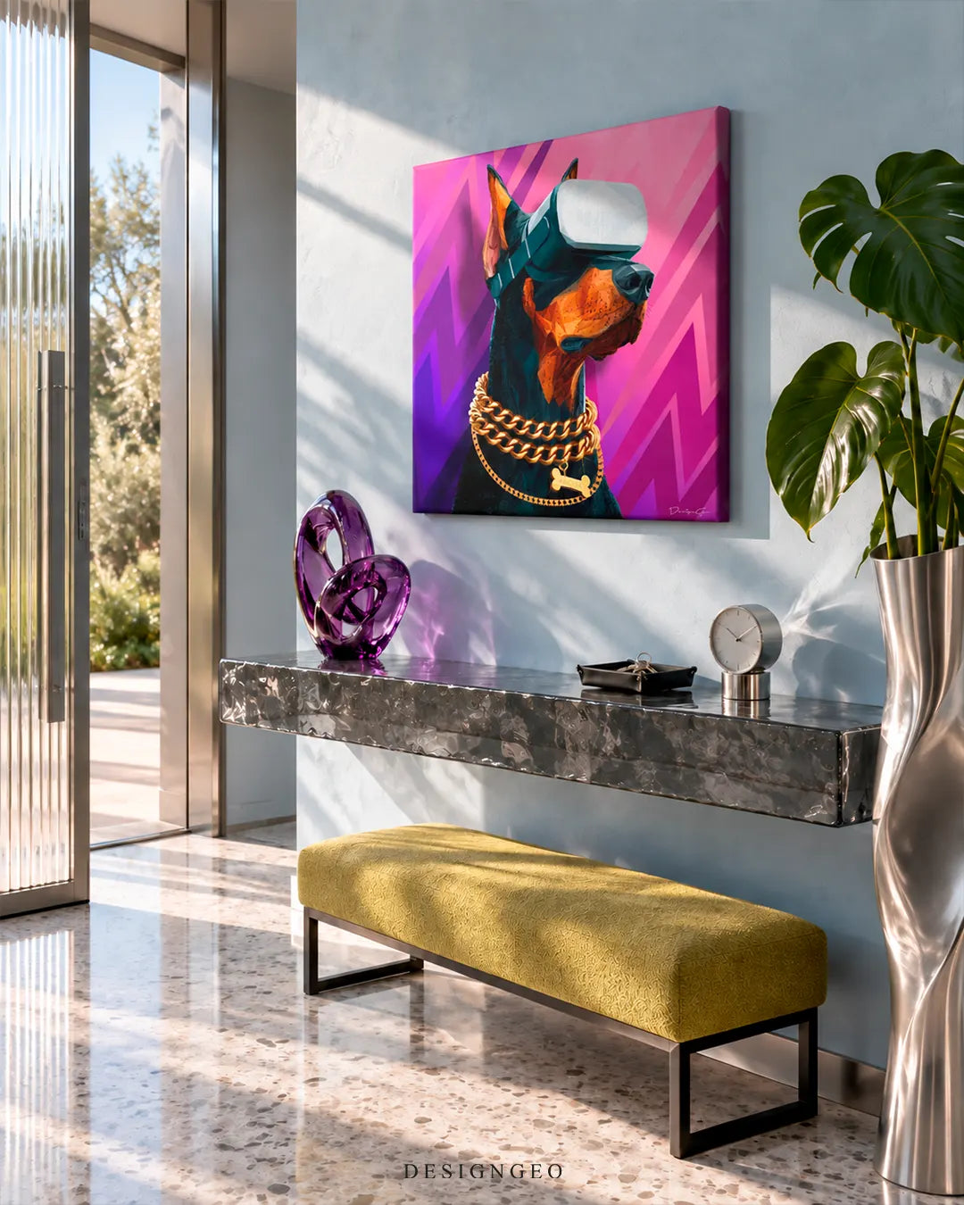 Square canvas print of a Doberman wearing VR goggles and a gold chain mounted on a light blue wall in a modern foyer above a marble console table
