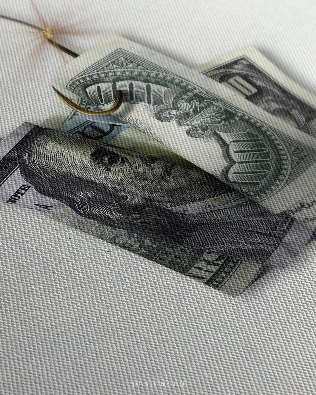 Close-up of minimalist financial wall art featuring a realistic US dollar bill attached to a fishing hook as bait on a clean white background