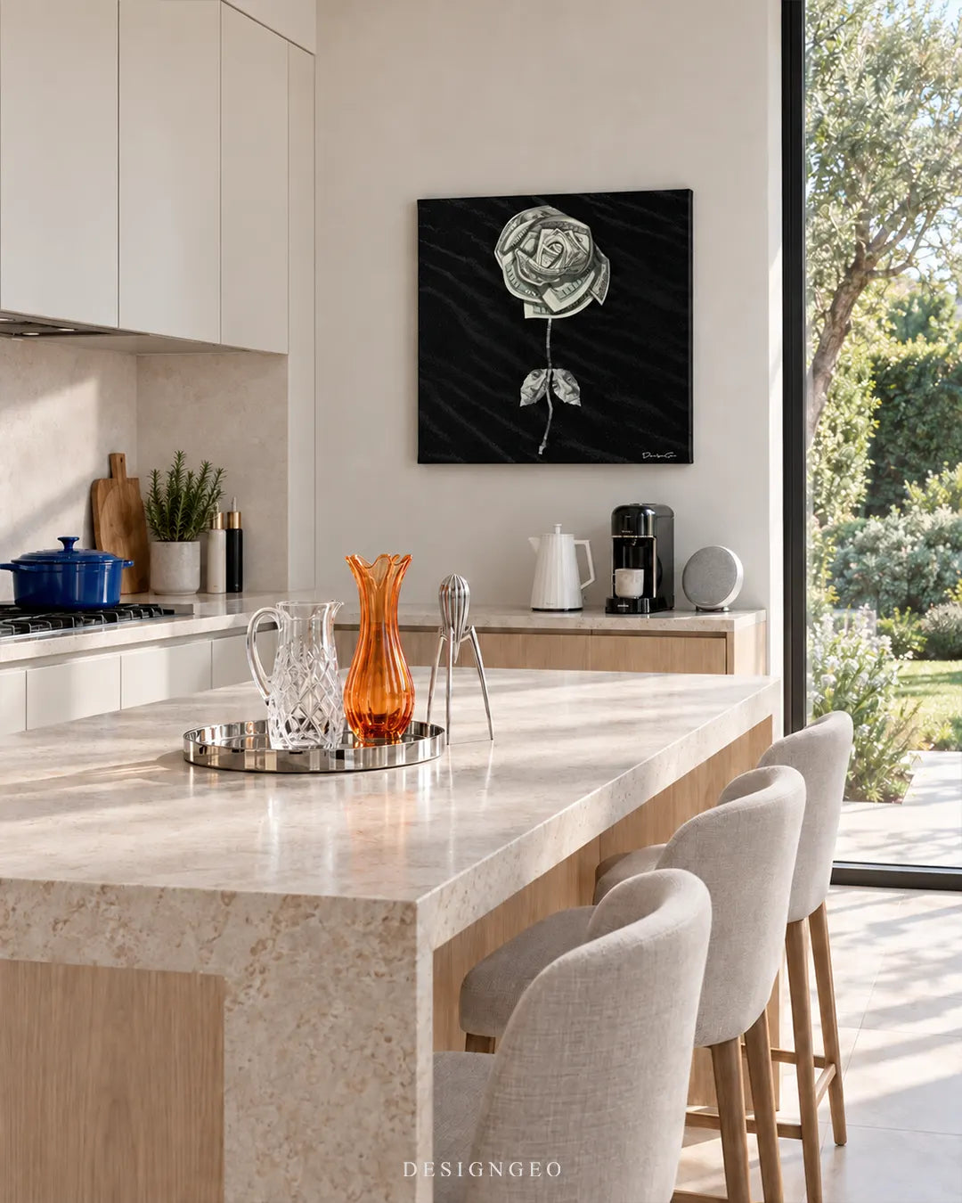 Square black canvas print featuring a rose made of folded US dollar bills mounted on a beige wall in a modern kitchen above a light wood counter with breakfast stools