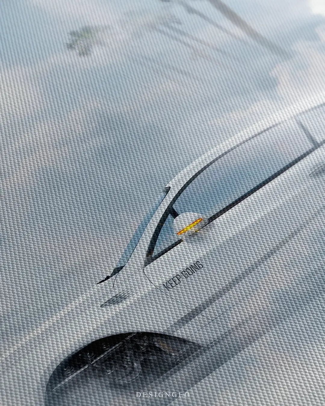 Close-up of futuristic wall art showing the Dream Chaser spacecraft gliding through thick white clouds with realistic metallic reflections and aerodynamic details