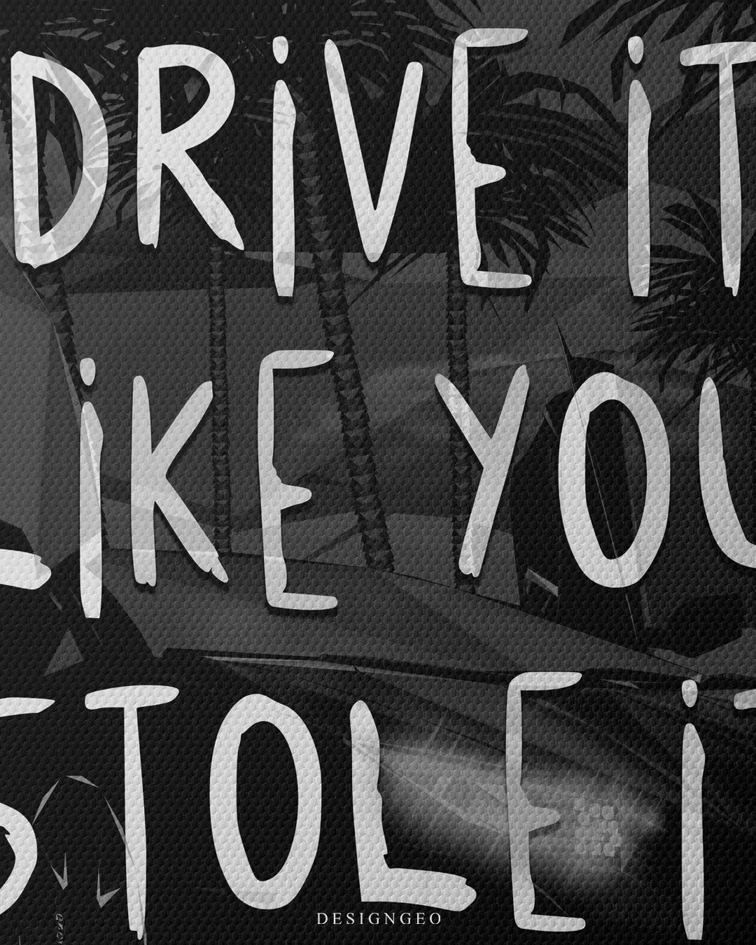 Close up macro texture view of handwritten Drive It Like You Stole It typography motivational quote on dark fine woven canvas artwork 0.75 inch thin wrap