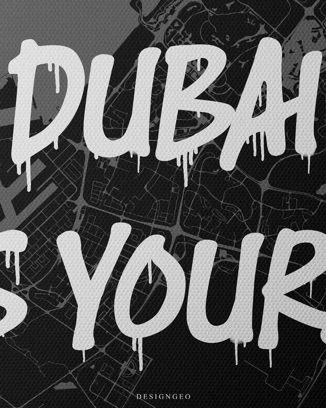 Close-up of Emirati luxury style wall art featuring a detailed Dubai city map with the motivational phrase "Dubai is Yours" in bold white graffiti typography on a dark background