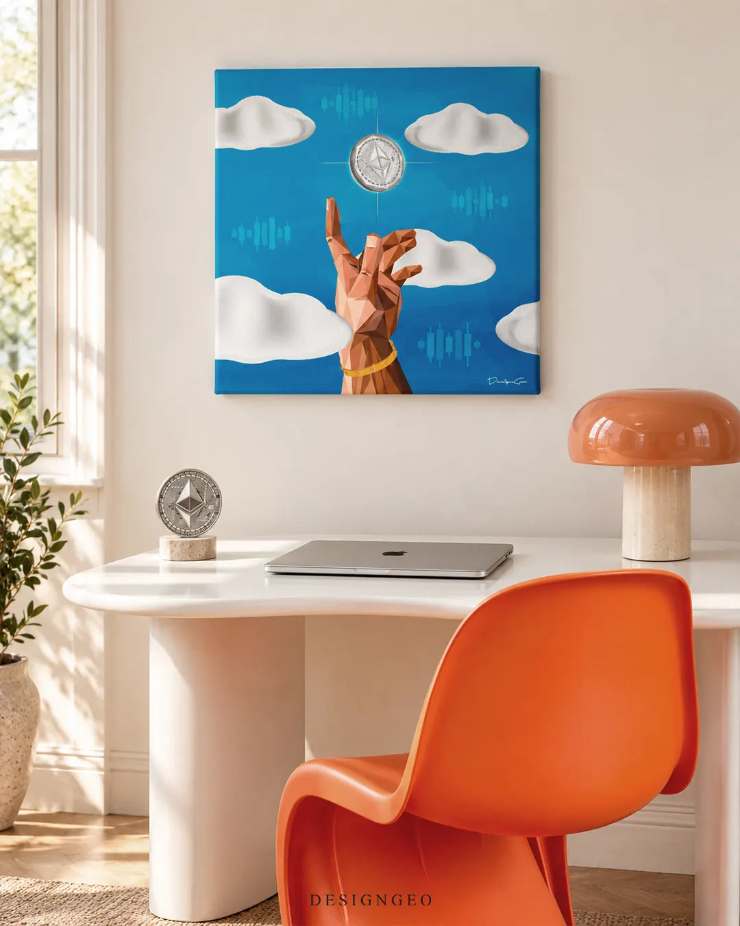 Square blue canvas print featuring a low-poly hand reaching for a glowing Ethereum coin among white clouds mounted on a cream wall above a white desk with an orange chair
