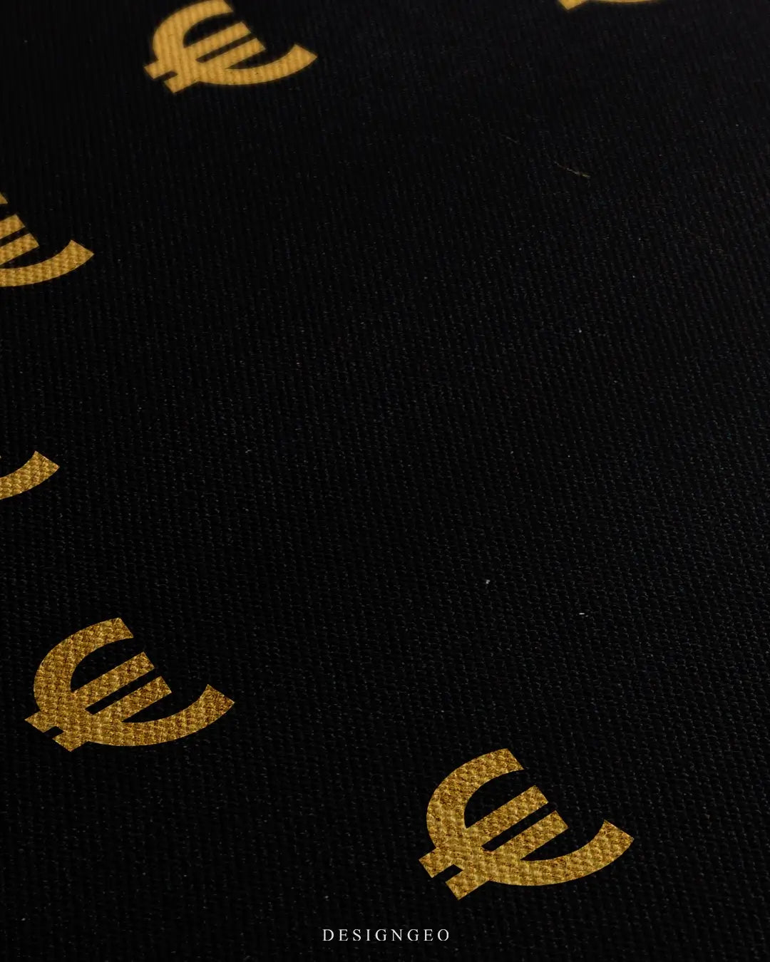 Close-up of modern minimalist wall art featuring a large Euro currency symbol with a detailed metallic texture on a deep black background