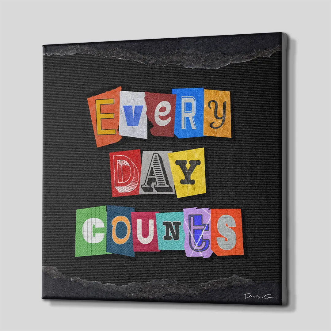 Three-quarter angle of the square typography canvas art, showing clean gallery-wrapped edges mounted on solid wooden stretcher bars against a simple neutral background