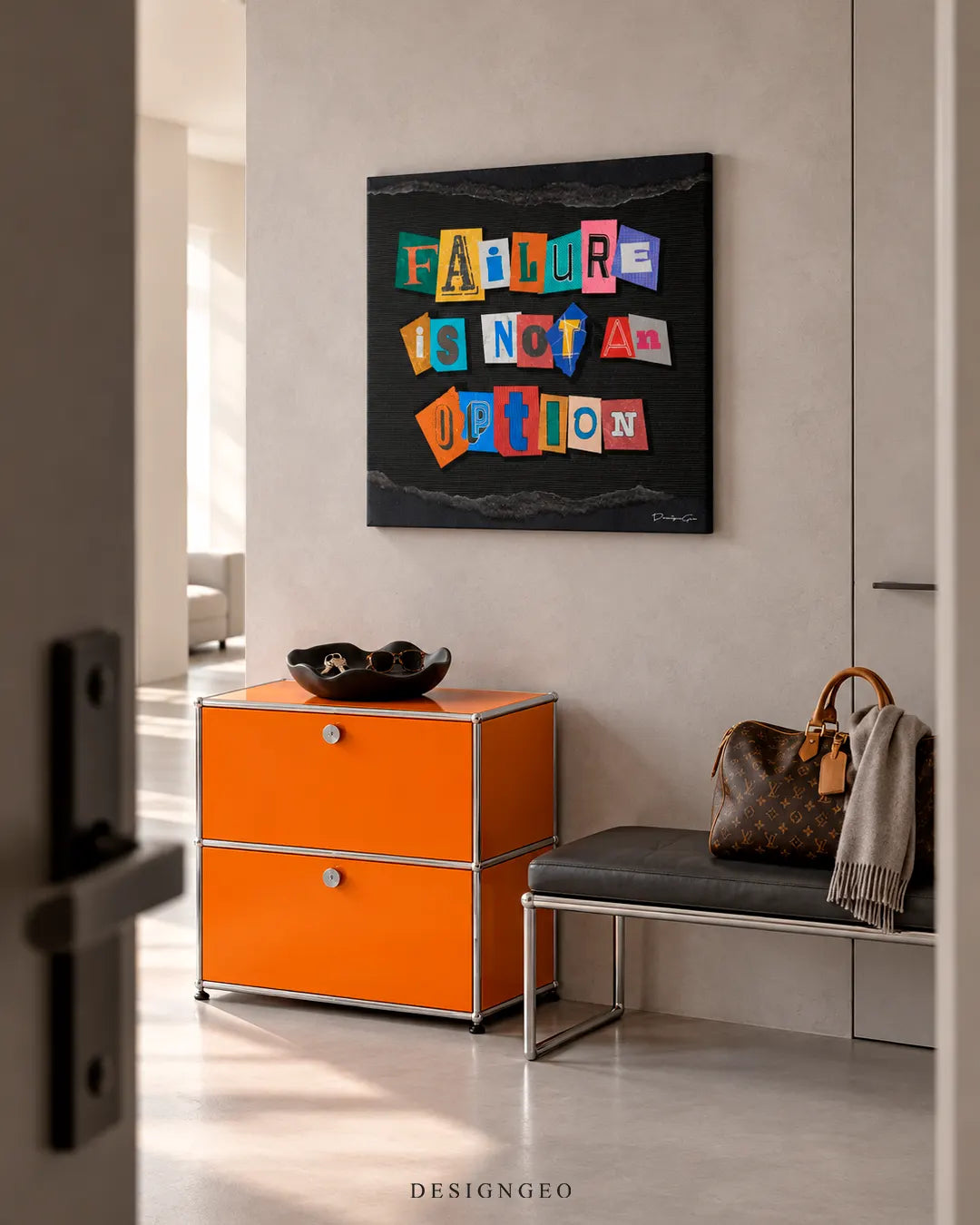 Modern luxury entryway decor featuring a square canvas print with colorful ransom note letters spelling FAILURE IS NOT AN OPTION mounted on a beige wall above an orange cabinet
