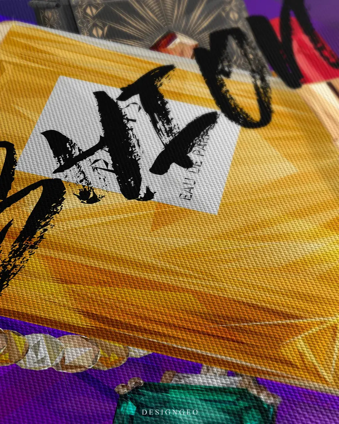 Close-up of fashion canvas wall art showing the bold black "FASHION" typography and detailed textures of a French perfume bottle on a purple background