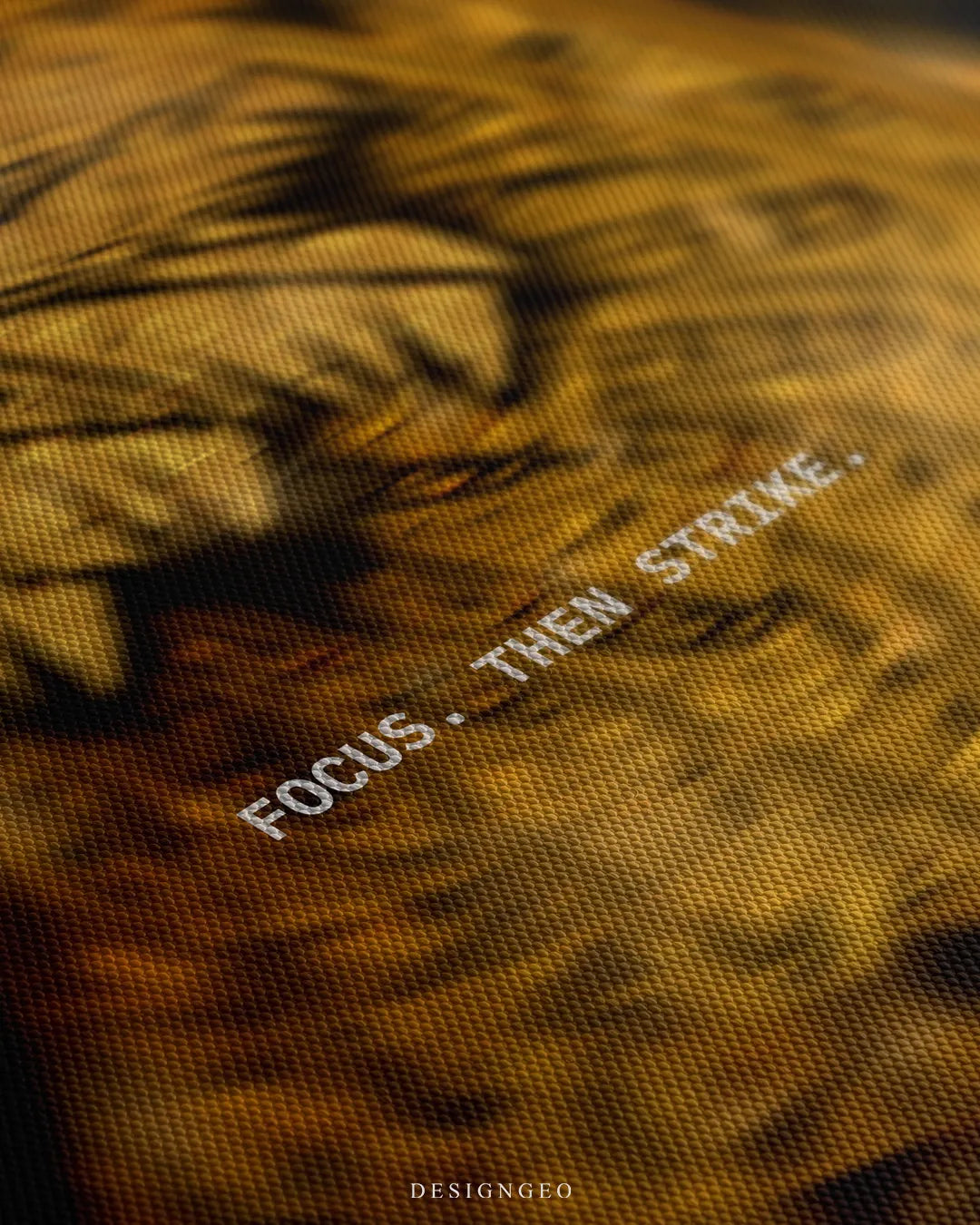 Angled detailed macro texture of fine woven canvas print showing golden eagle head profile and beak with Focus. Then Strike. quote