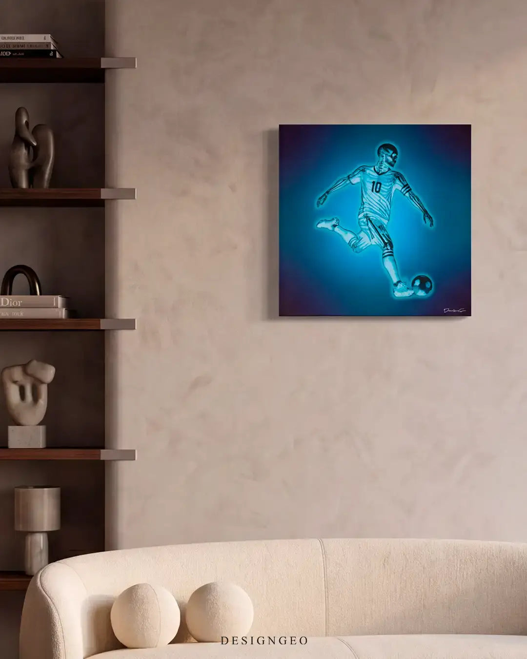 Modern minimalist living room interior featuring the square blue x-ray soccer player canvas print mounted on a beige stucco wall above a contemporary cream sofa