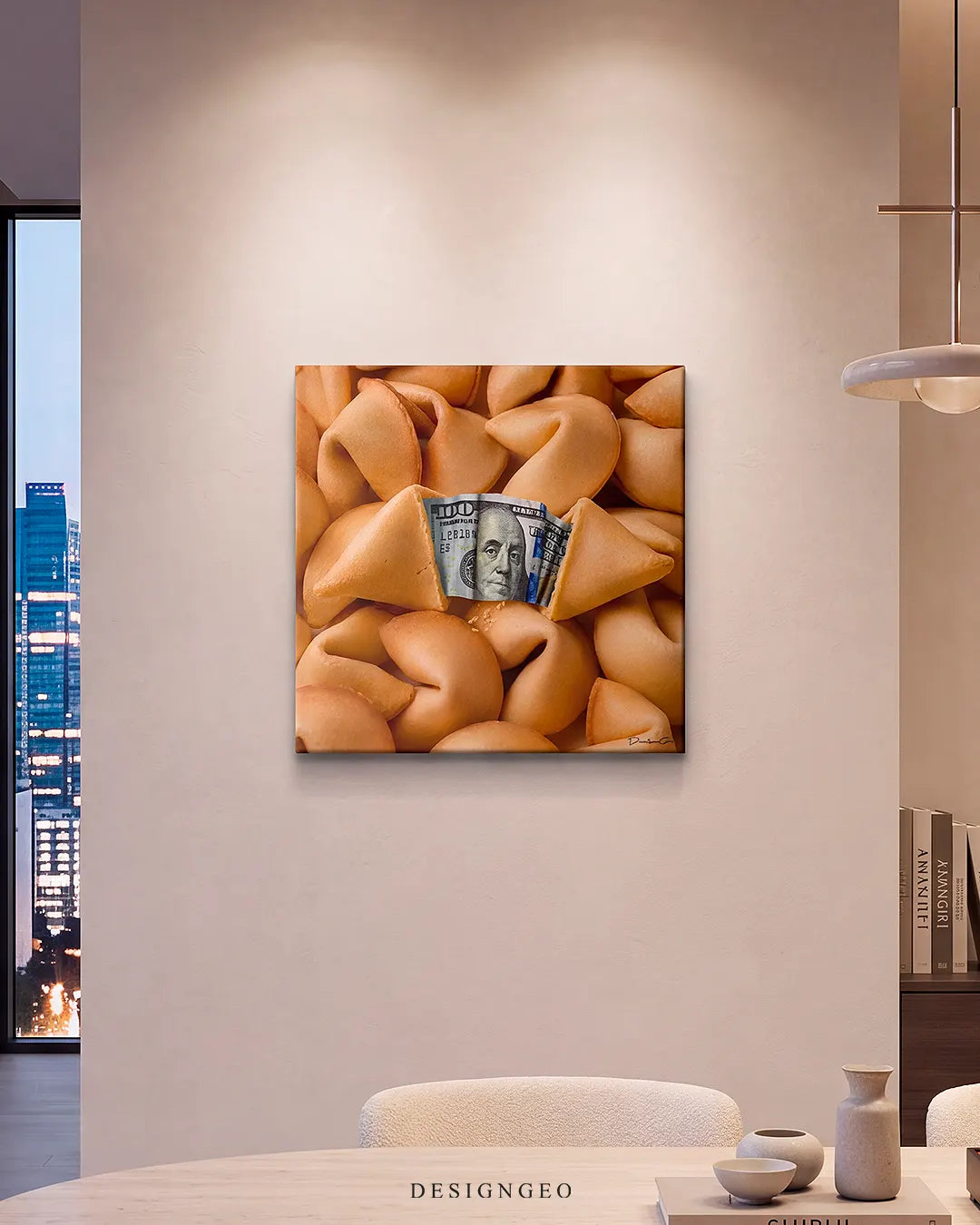 Modern luxury apartment wall display featuring the square fortune cookie canvas art illuminated above a dining table and city skyline window