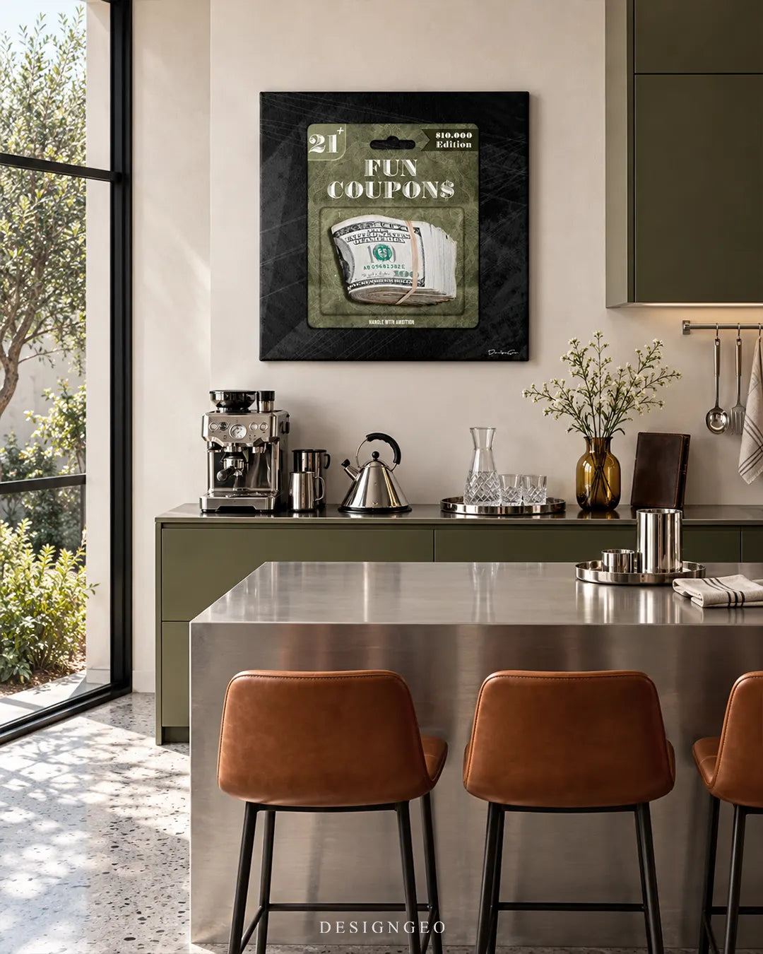 Square dark canvas print featuring toy-packaged US dollar bills with FUN COUPONS typography mounted on a light wall in a modern kitchen above olive cabinets and a stainless steel island