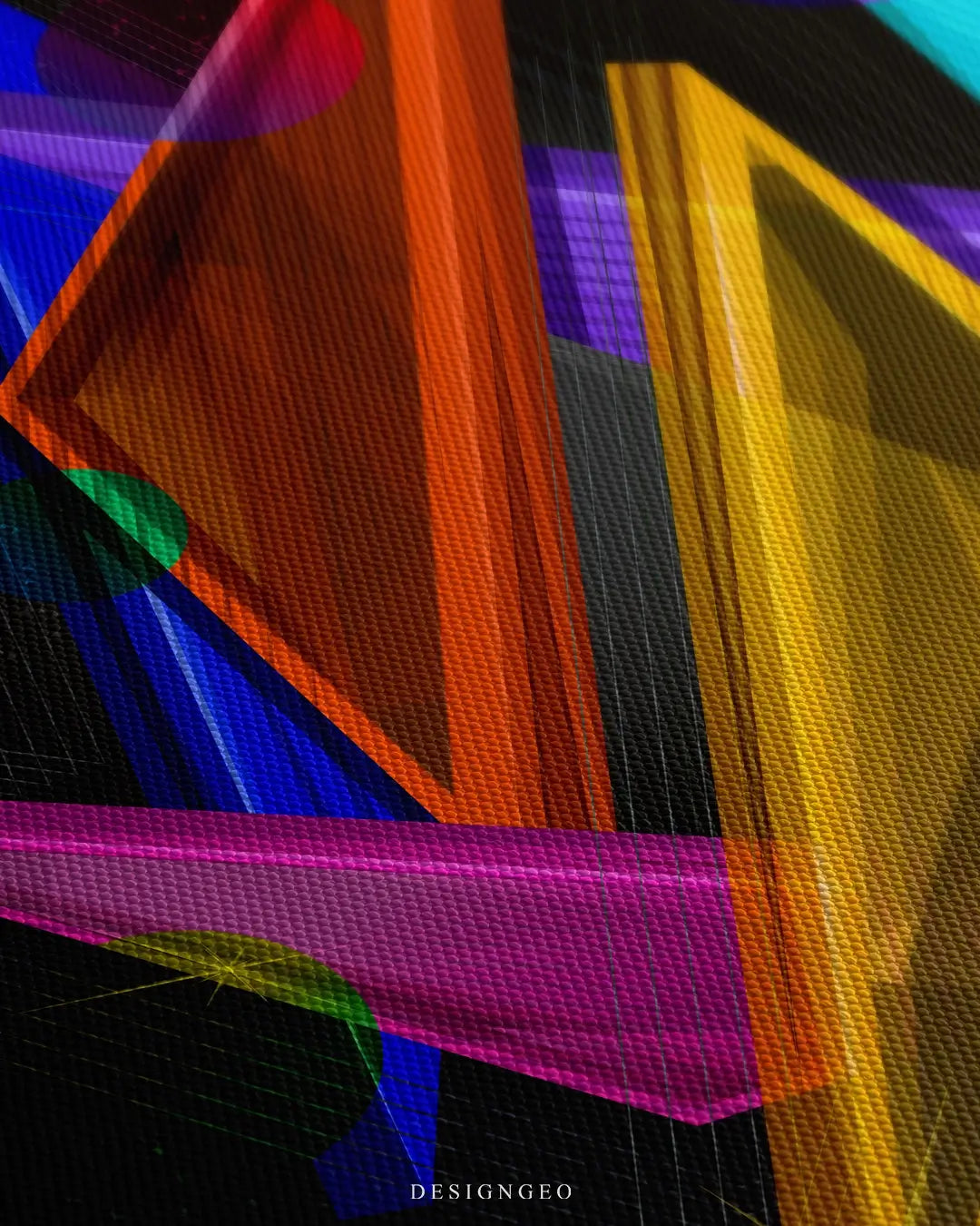 Close-up of modern abstract wall art featuring overlapping neon triangles in blue, pink, and orange with glowing light effects on a solid black background