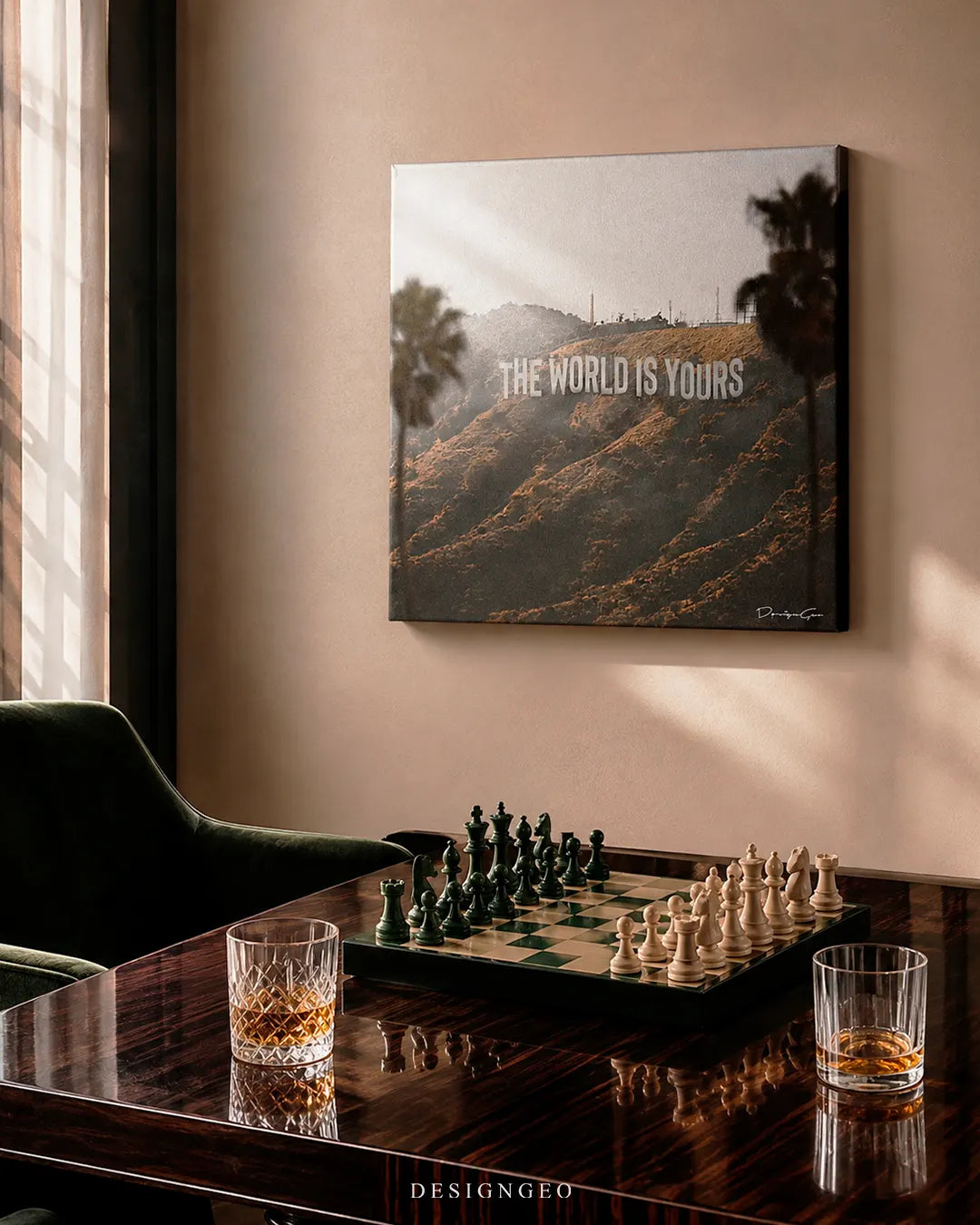 Square The World Is Yours Hollywood Hills canvas print mounted on a beige wall above a polished wood table set with a marble chess set and whiskey glasses