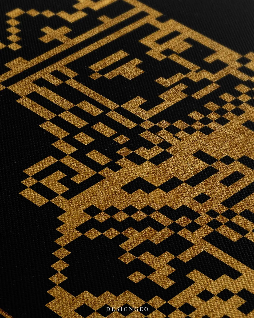 Close-up side view of a canvas wall art featuring a gold pixelated king character over black background, showing the high-quality ink detail and the textured canvas surface