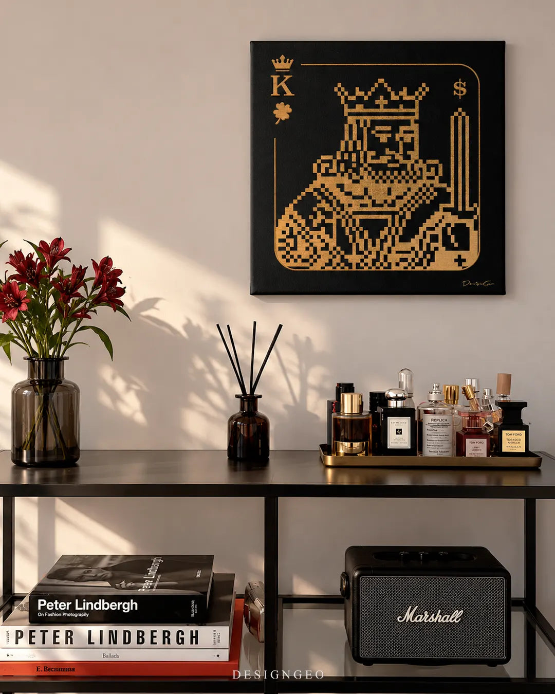 King of Wealth pixel art gold playing card square canvas wall art mounted on light wall above console table with luxury perfumes and Marshall speaker 0.75 inch thin wrap