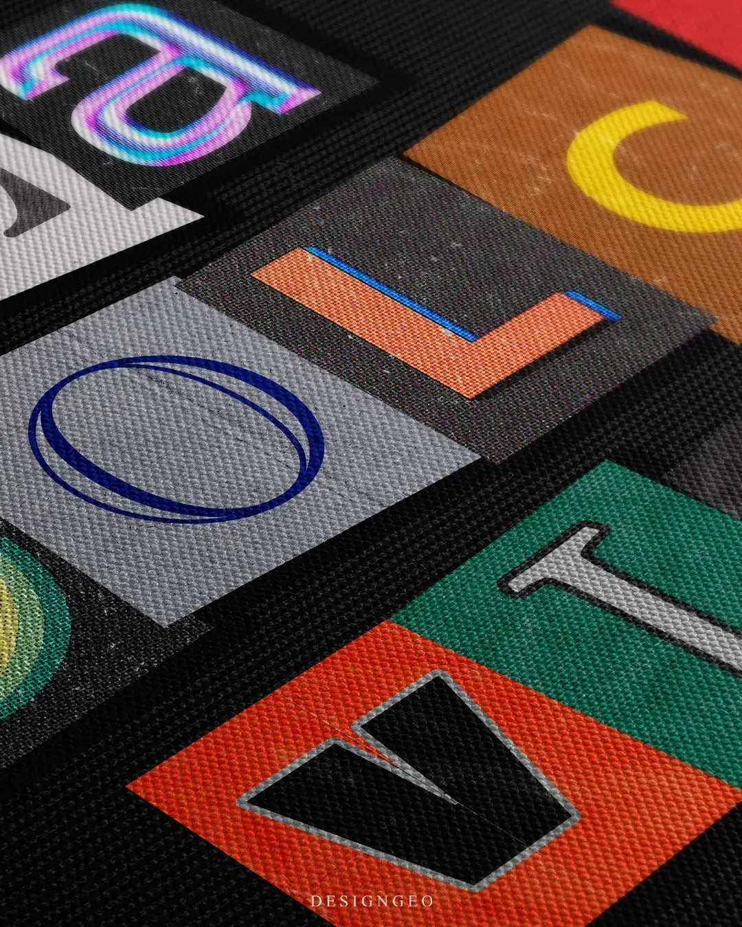 Close-up of modern typography wall art featuring the phrase La Dolce Vita in vibrant, multicolored letters on a solid black background