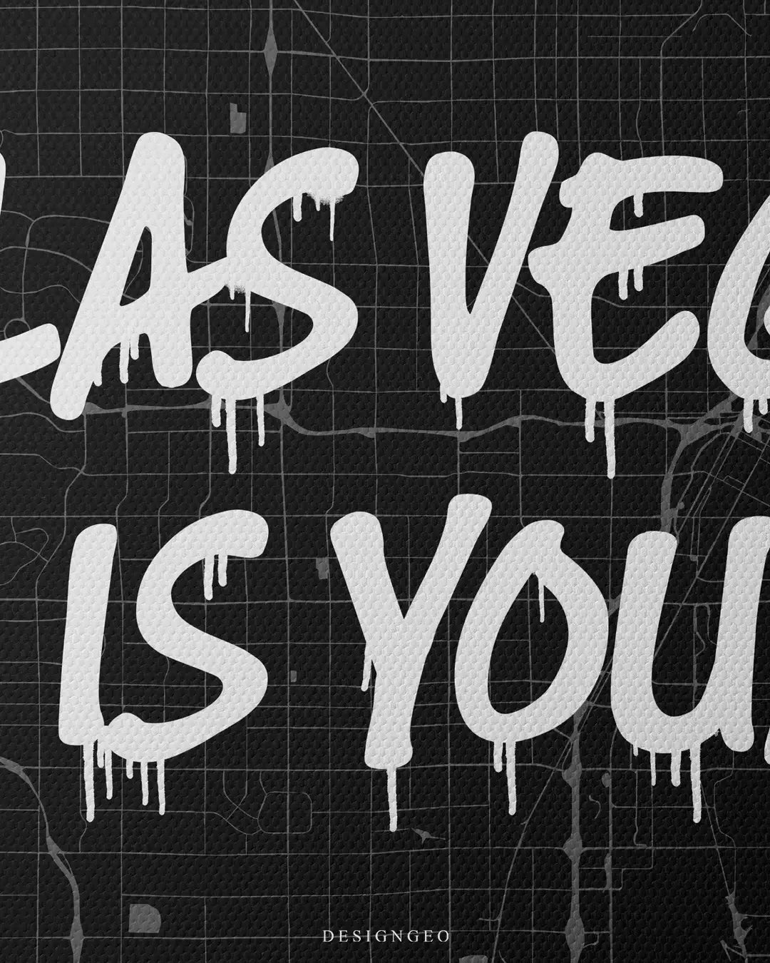 Close-up of modern urban wall art featuring a detailed Las Vegas city map layout with the motivational phrase "Las Vegas is Yours" in bold white graffiti typography on a dark background