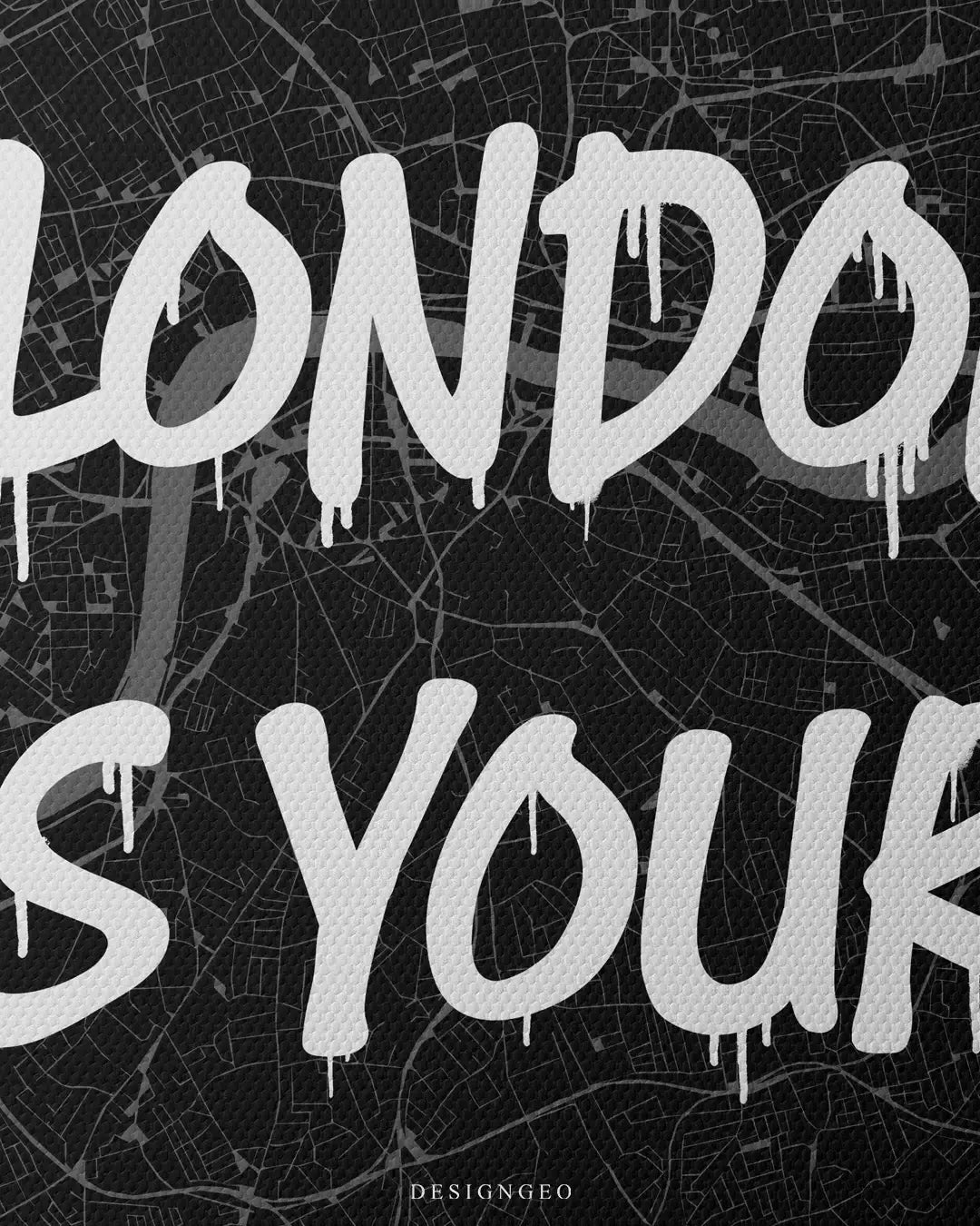 Close-up of sophisticated English style wall art featuring a detailed London city map with the motivational phrase "London is Yours" in bold white graffiti typography on a dark background