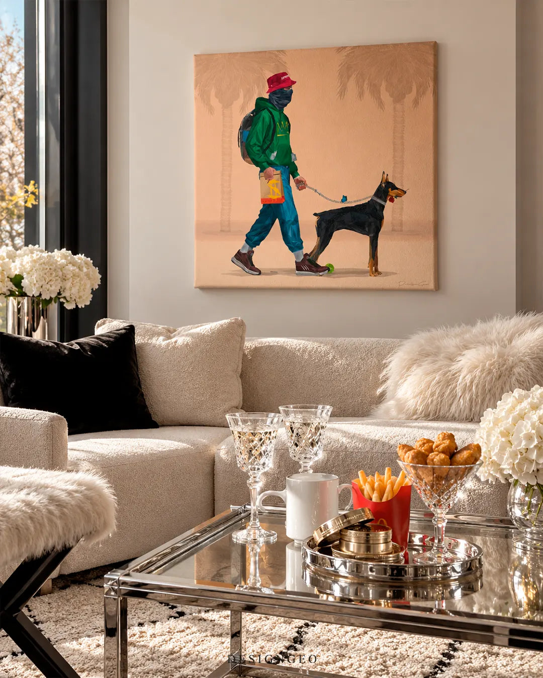 Streetwear man walking Doberman pincher square canvas wall art displayed on a beige wall in an elegant living room above a cream bouclé sectional sofa and glass coffee table