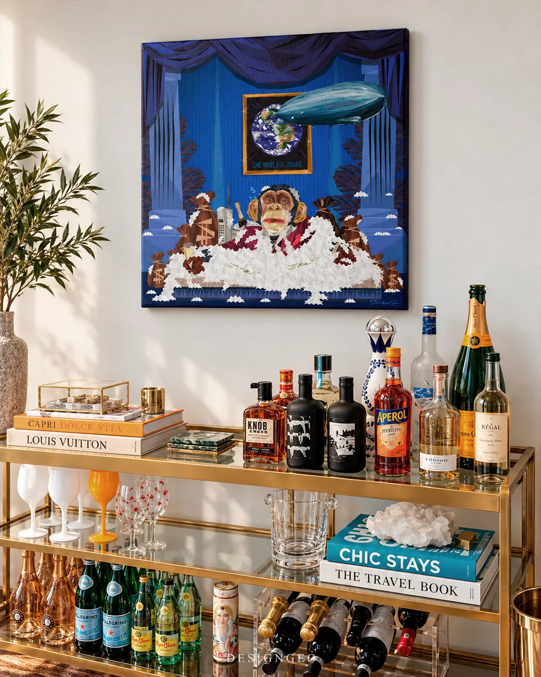 Scarface inspired chimpanzee with cash and blimp square canvas wall art displayed on a white wall above a gold glass bar cart filled with liquor bottles and coffee table books 0.75 thin wrap