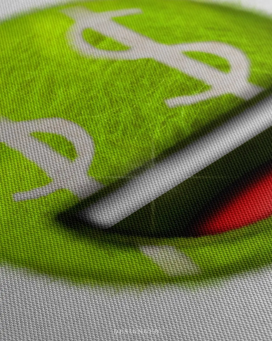 Close-up of modern money-themed wall art featuring a neon yellow tennis ball with dollar sign eyes on a crisp, intense white background