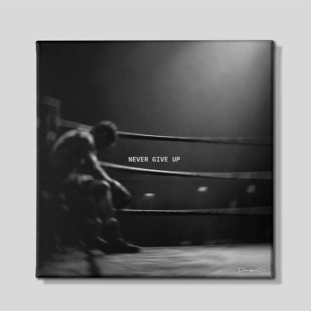 Black and white square motivational canvas wall art featuring a boxer sitting in the ring corner between rounds under quote Never Give Up 0.75 inch thin wrap