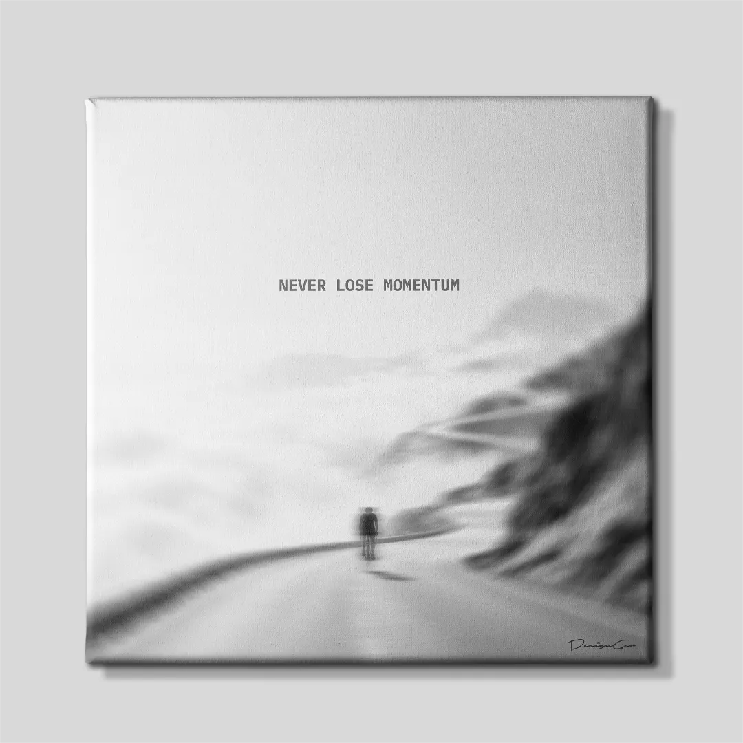 Black and white square canvas art featuring a cyclist riding up a mountain road with quote Never Lose Momentum 0.75 inch thin wrap