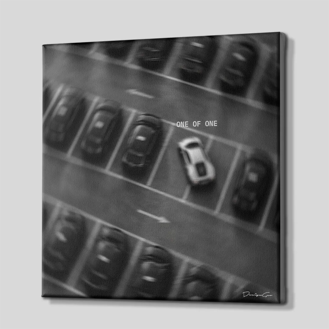Side perspective view of black and white square inspirational canvas wall art showing parking lot artwork with dark gallery wrapped edge 0.75 inch thin wrap