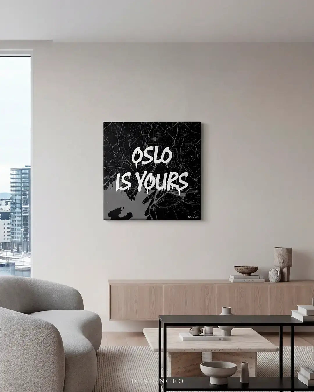 Modern minimalist living room interior displaying the black and white Oslo city map canvas print mounted on a neutral wall above a contemporary wooden console table