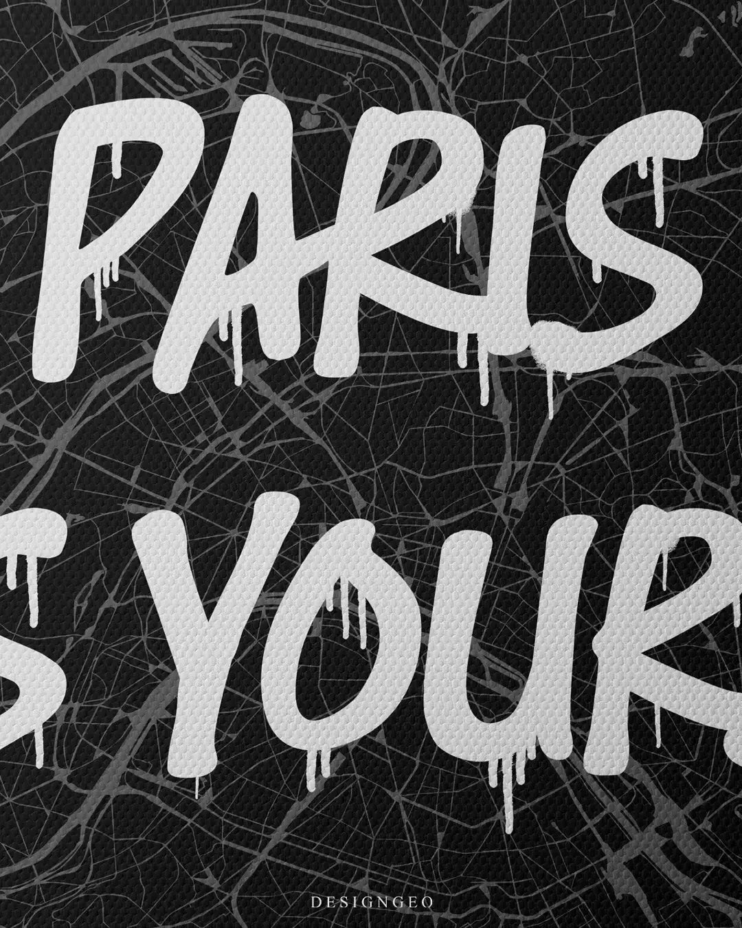 Close-up of elegant French style wall art featuring a detailed Paris city map with the motivational phrase "Paris is Yours" in fluid white graffiti typography on a dark background