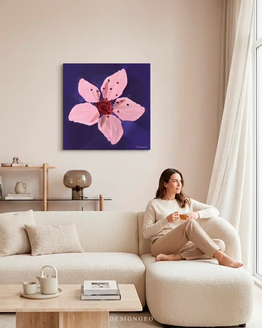 Modern livingroom interior displaying the minimalist pink cherry blossom square canvas print above a sofa, creating a calm and relaxing atmosphere in home decor