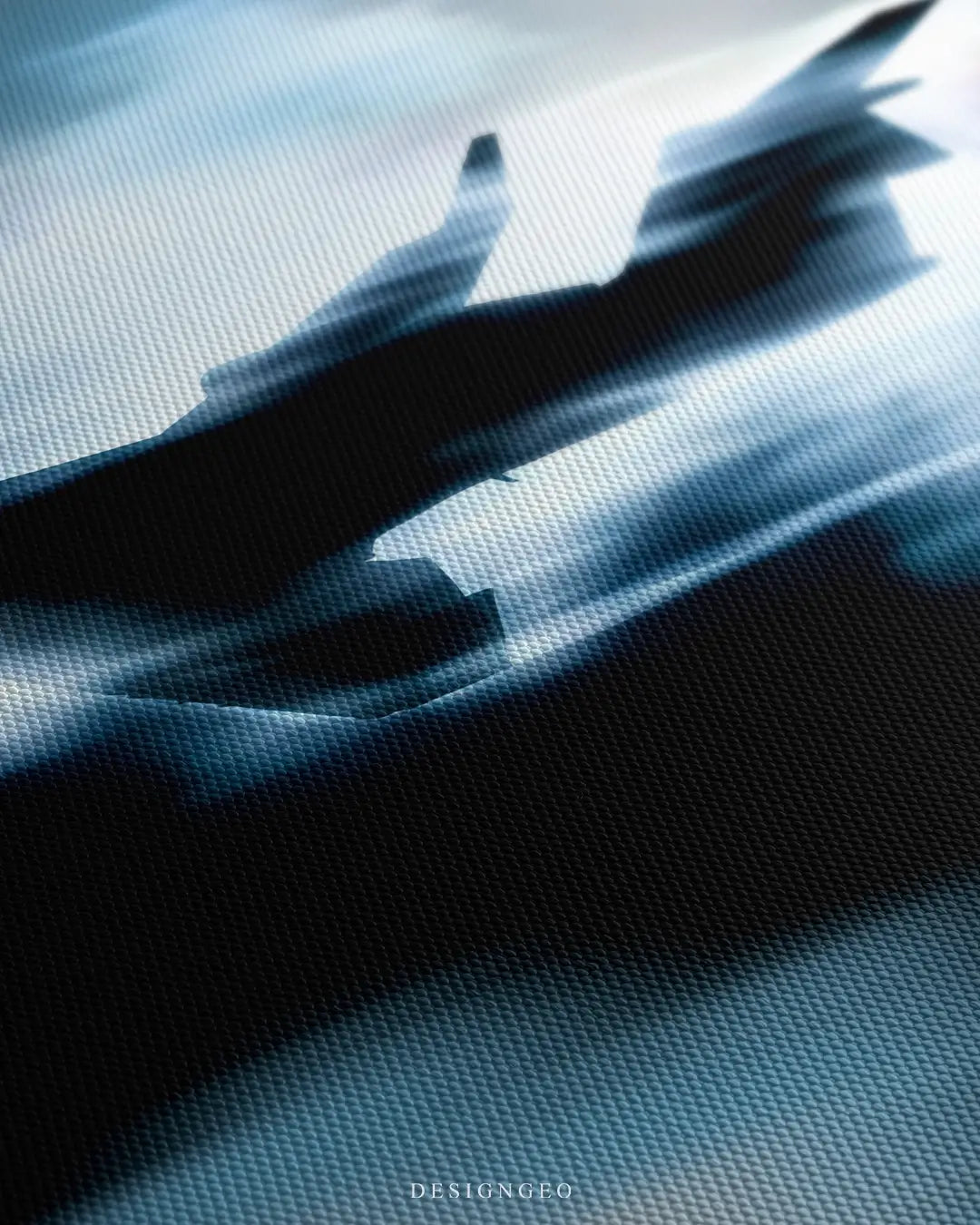 Close-up of a canvas wall art featuring a private jet flying through blue clouds, showing detailed motion blur and woven fabric texture