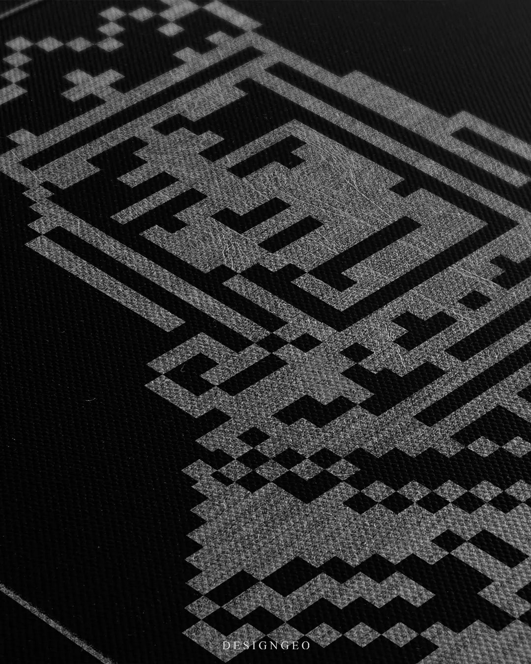 Close-up side view of a canvas wall art featuring a silver pixelated queen character, showing the fine canvas texture and sharp metallic ink detail.