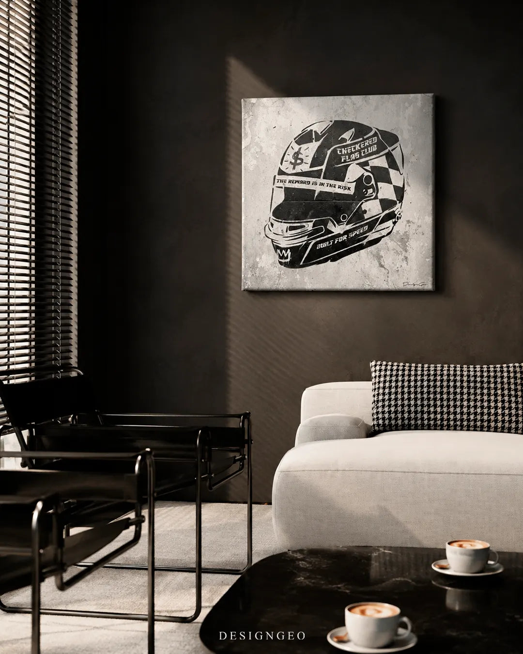 Square monochromatic racing helmet canvas print mounted on a dark grey wall in a modern living room beside black Wassily chairs, a off-white sofa with houndstooth pillow, and a black marble coffee table with two cups of coffee