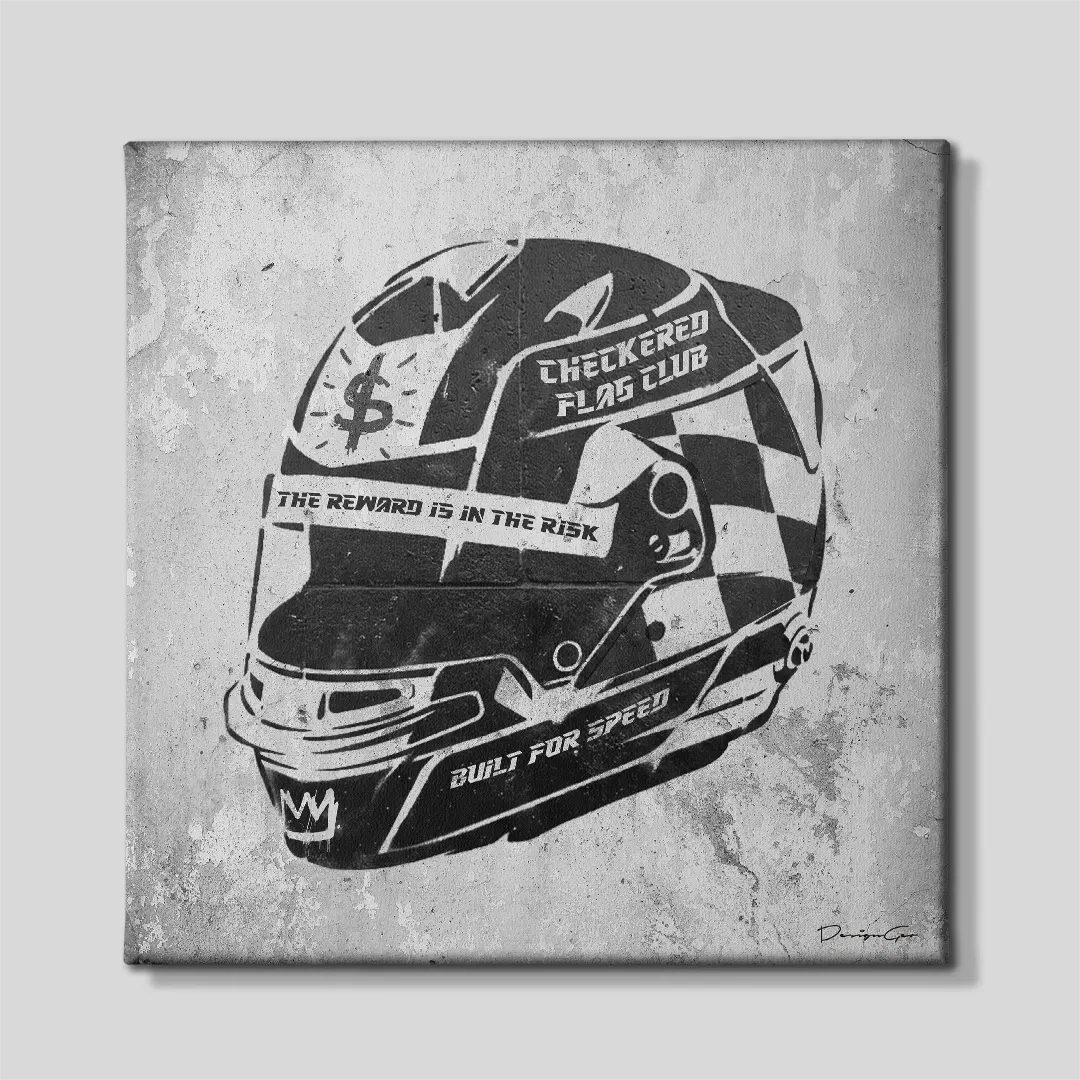 Front view of the square racing helmet canvas art, featuring a black stencil F1 helmet with checkered flag patterns and typography reading "The Reward is in the Risk" on a grey concrete background
