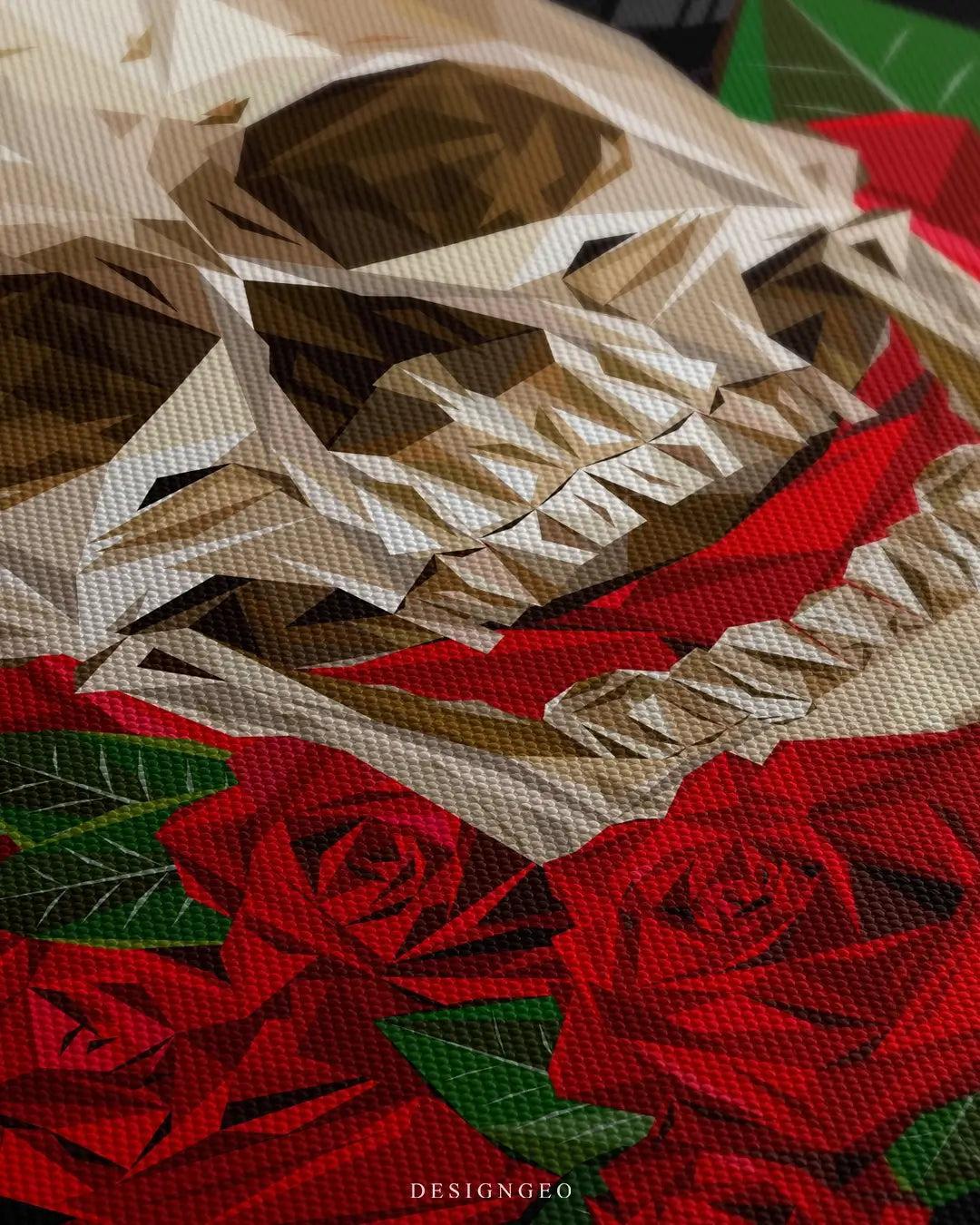 Close-up of gothic wall art featuring a highly detailed human skull surrounded by vibrant red roses with realistic petal textures on a black background