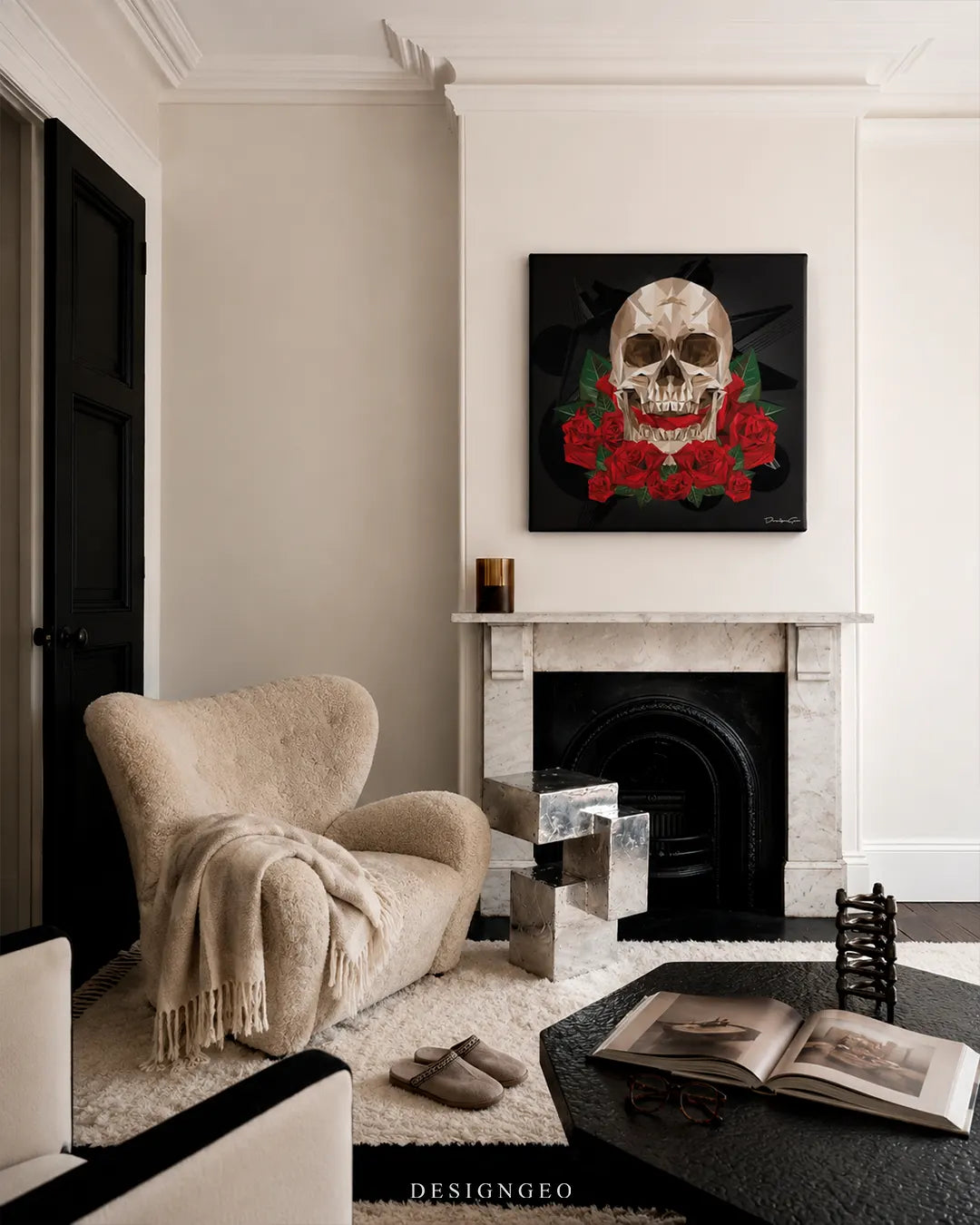 Square geometric skull and red roses canvas wall art mounted on a cream wall above a white marble fireplace mantle in a modern luxury living room with a cream armchair